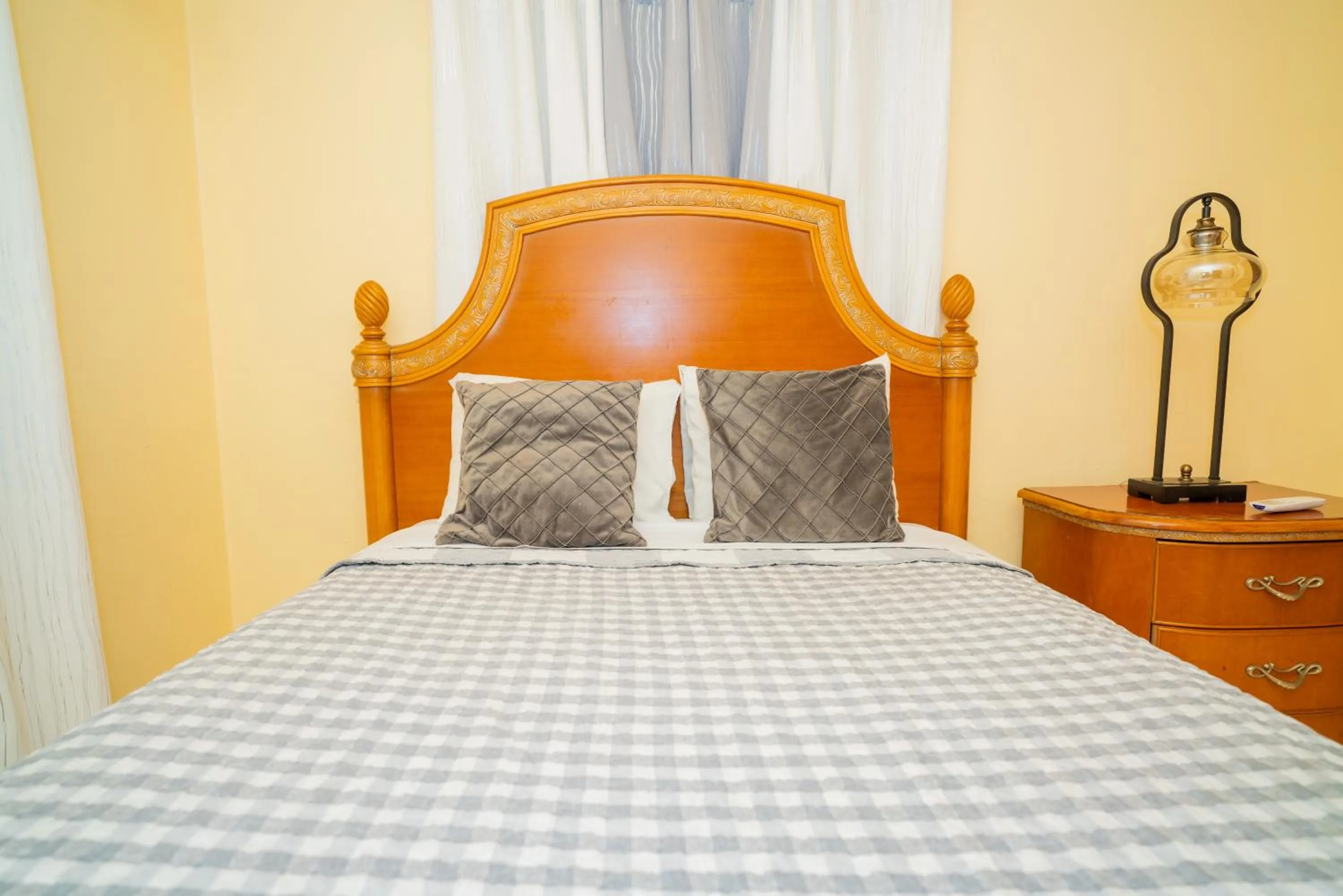 Bed in Connie's Comfort Suites