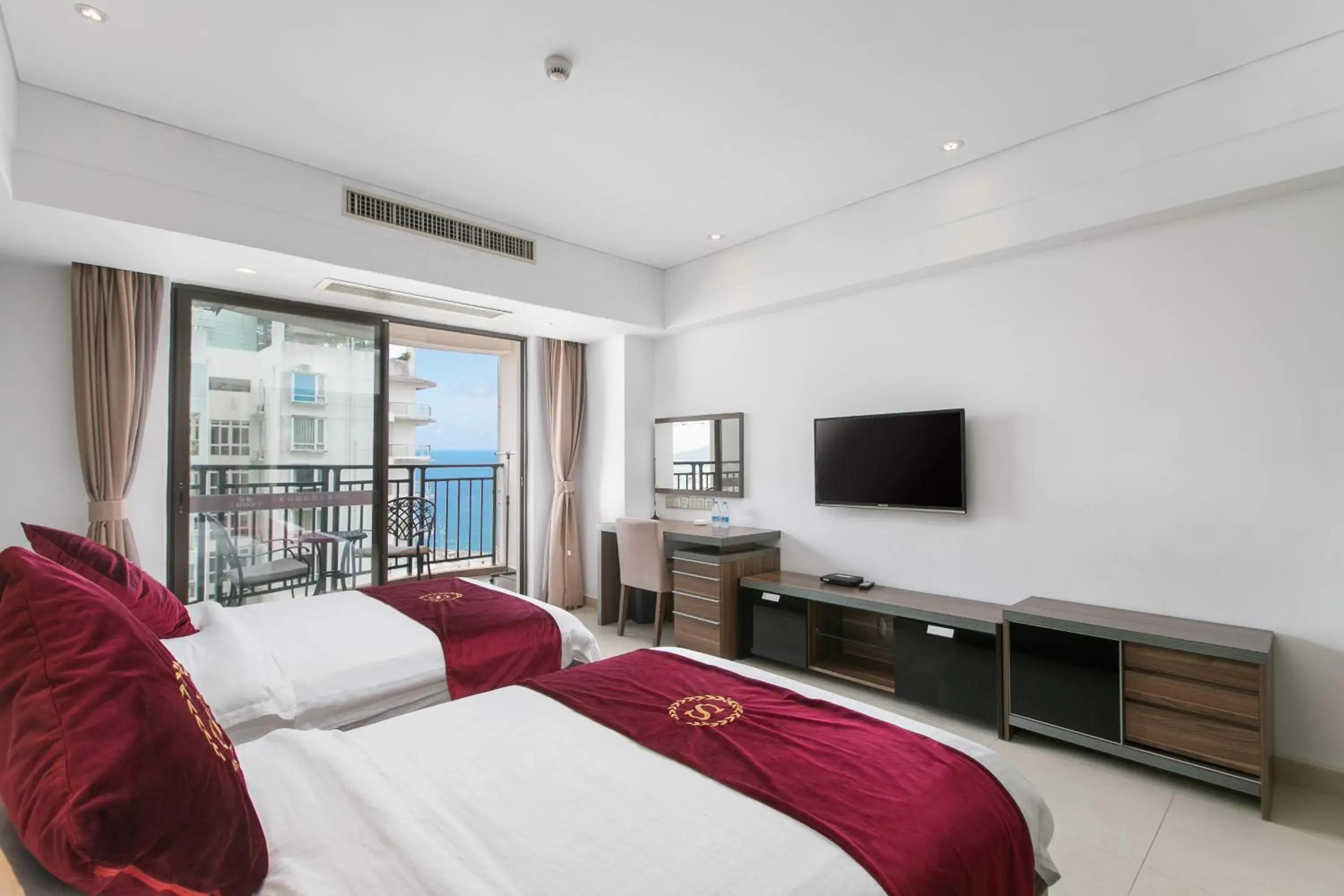 Twin Room with Side Sea View in Sanya Sun and Sea Gueshouse Twin Room with Side Sea View in Sanya Sun and Sea Gueshouse