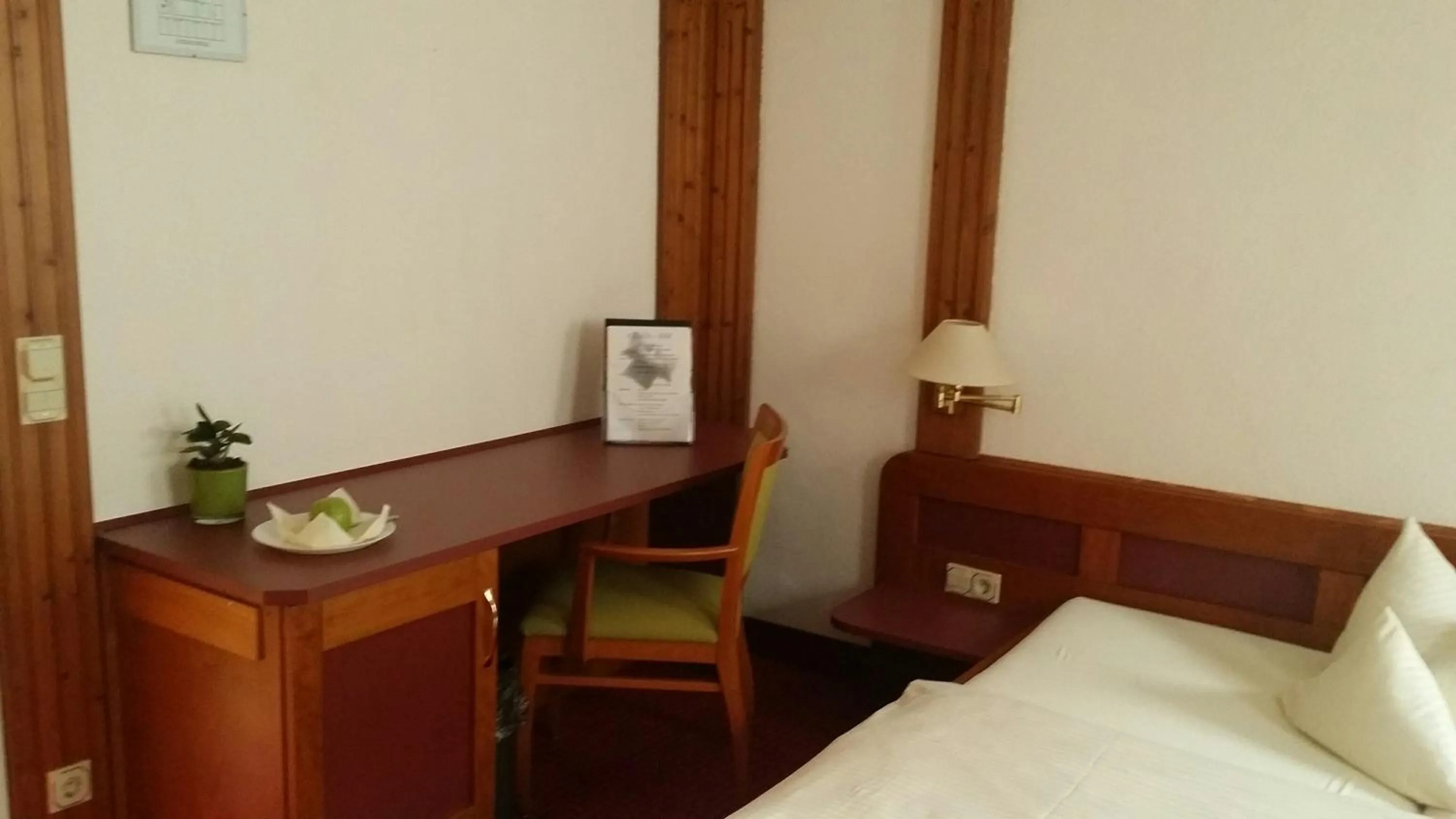 Seating area, Bed in Hotel Augsburger Hof