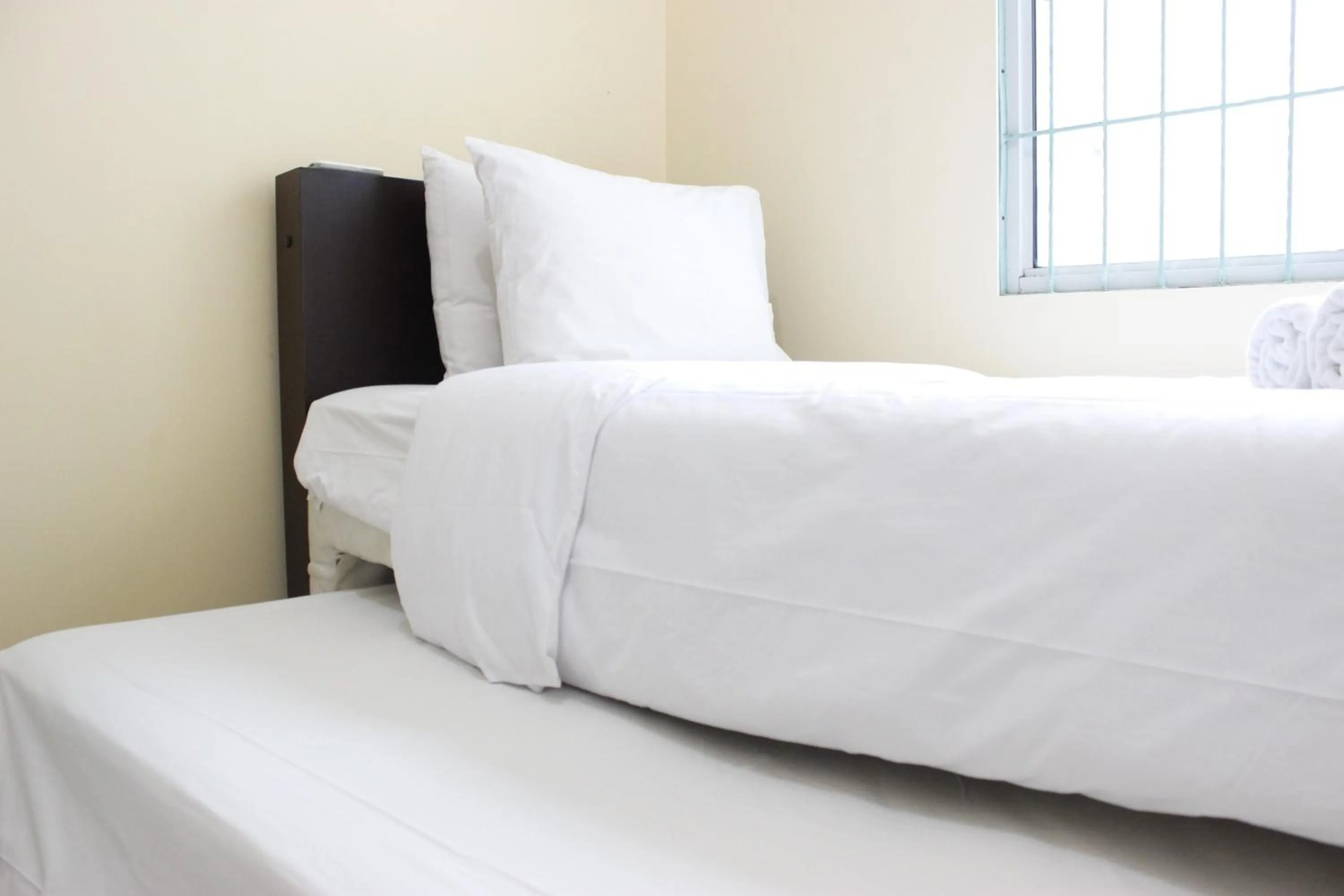 Bed in Deluxe & Cozy 4BR Galeri Ciumbuleuit Apartment By Travelio