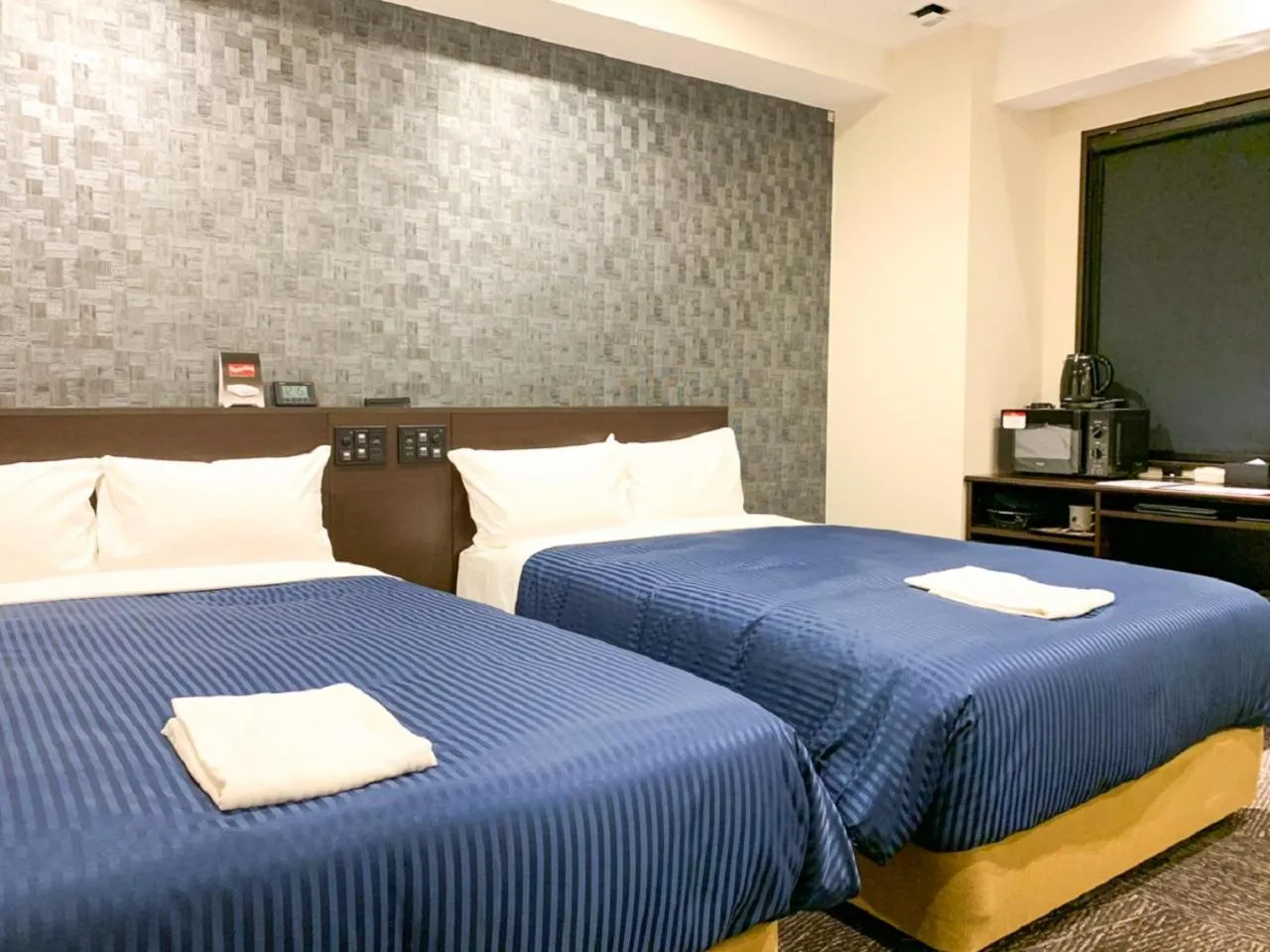 Bed in HOTEL LiVEMAX Nishinomiya