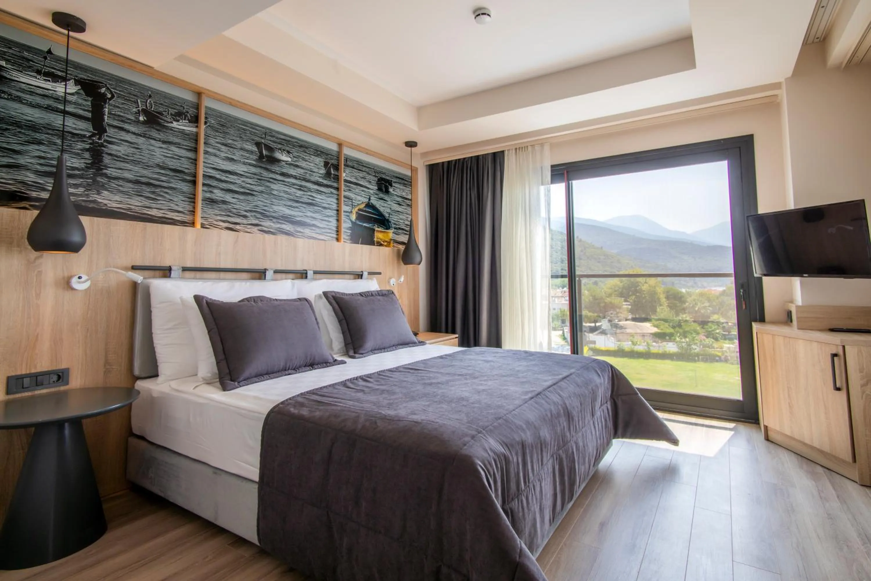 Bed in MAIA Luxury Beach Hotel & Spa