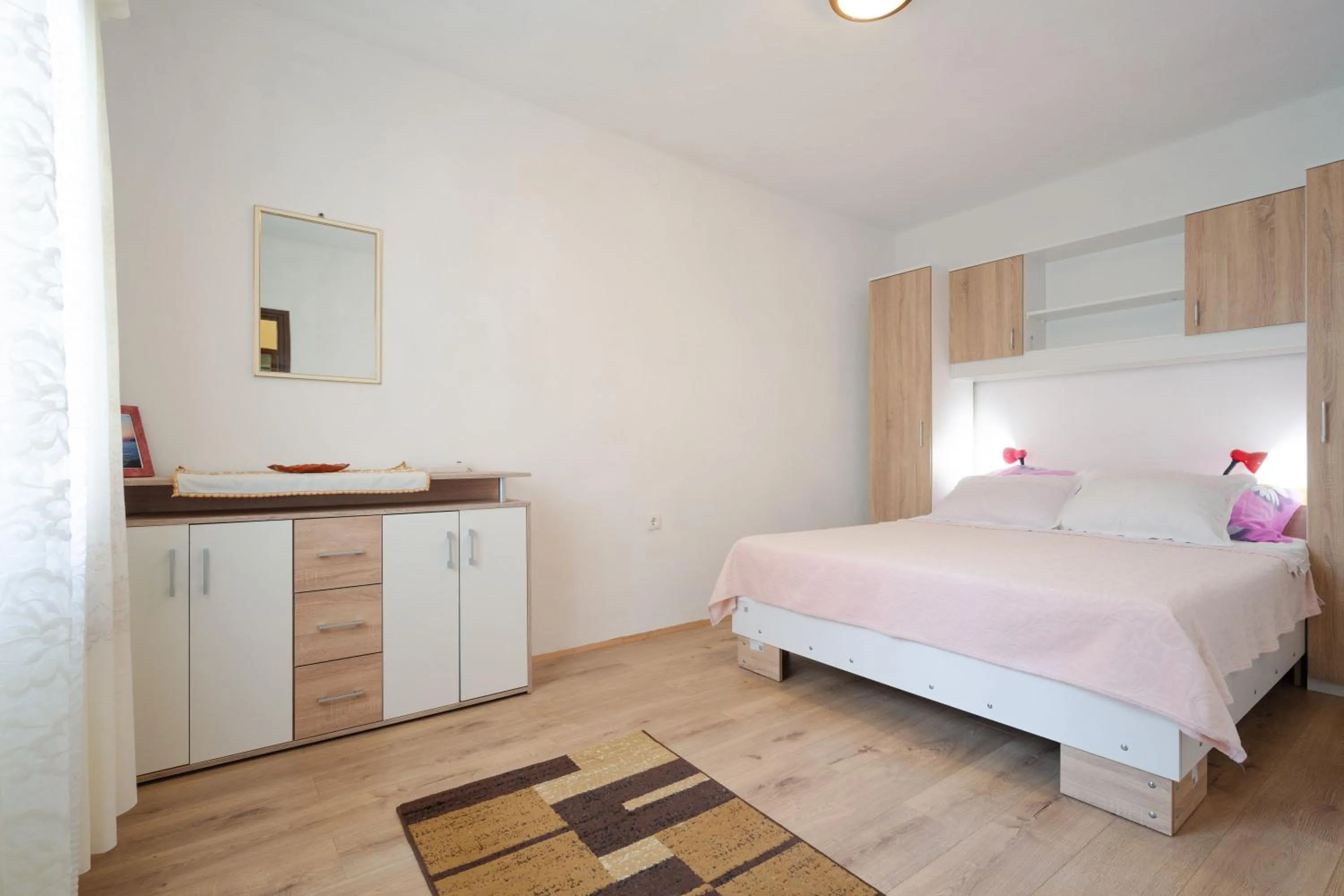 Bed in Apartments Ljiljana