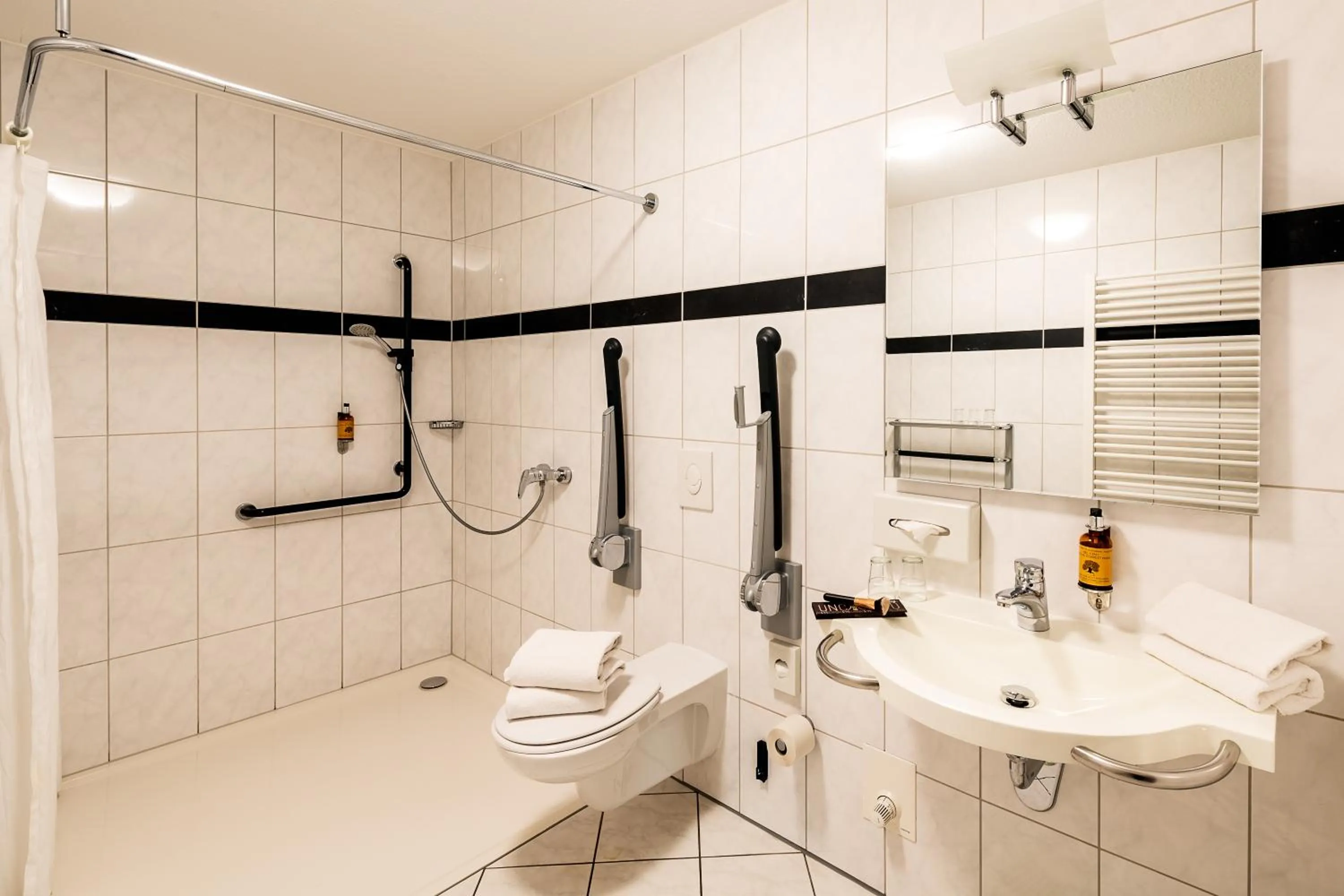 Bathroom in Apparthotel Bad Schandau by STEIGER Hotels