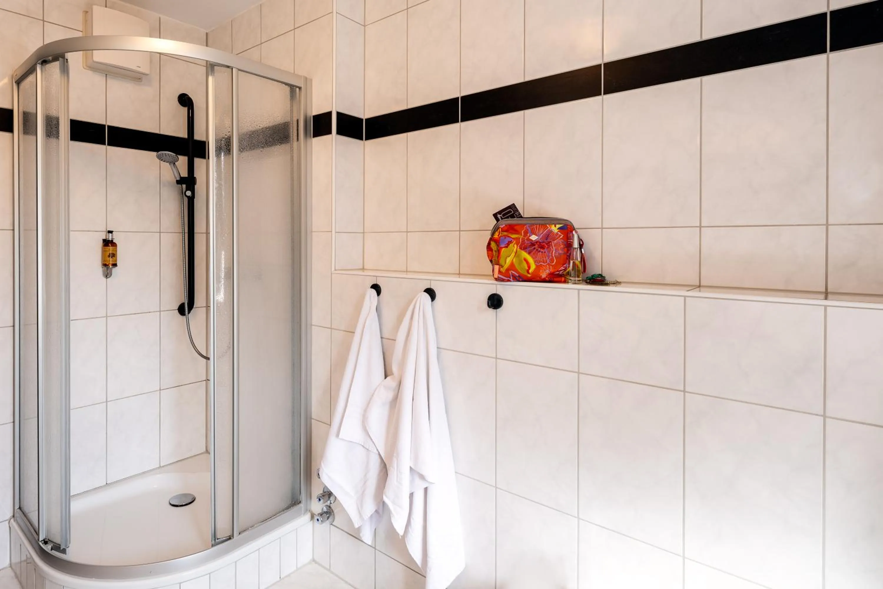 Bathroom in Apparthotel Bad Schandau by STEIGER Hotels