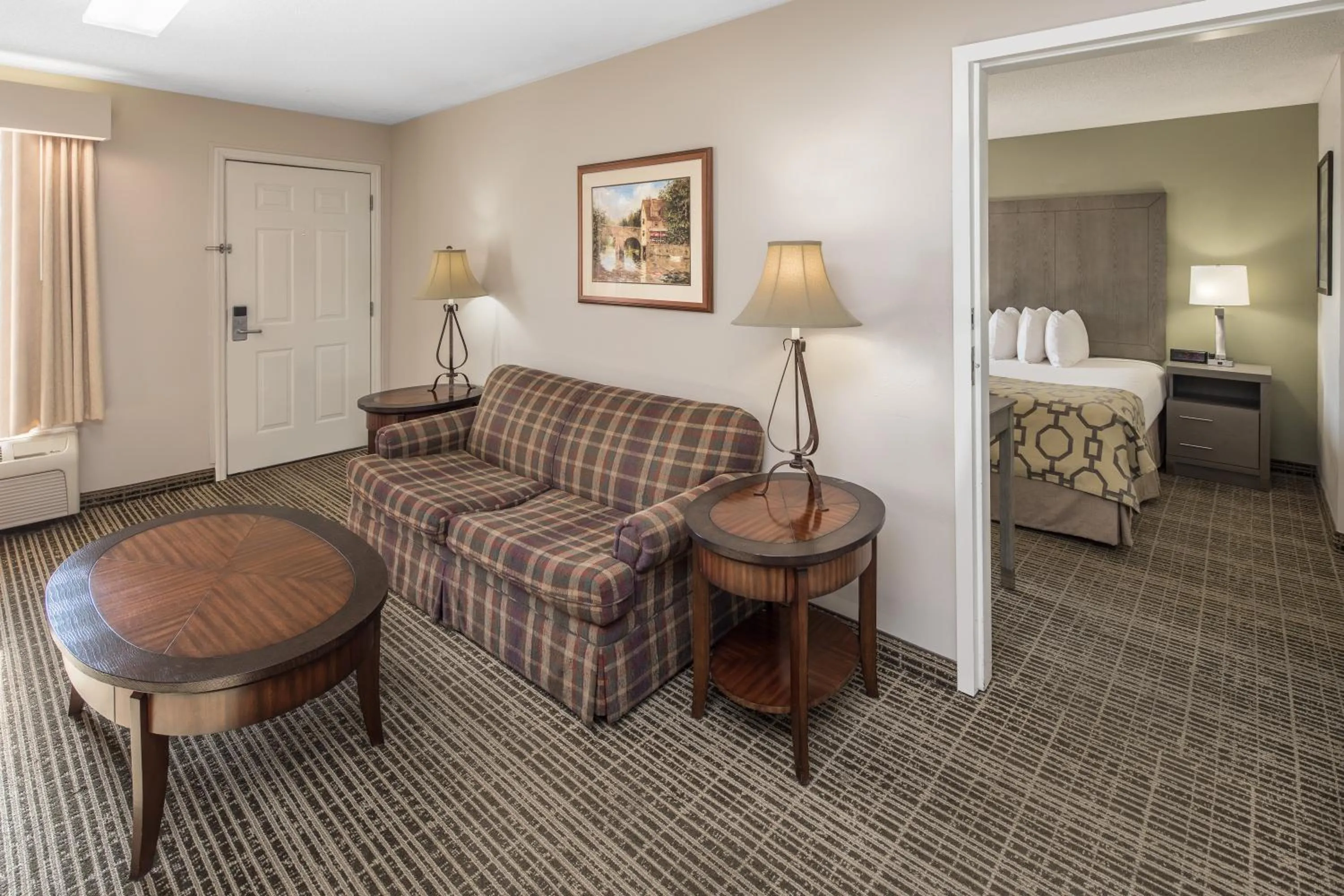Seating area, Bed in Baymont by Wyndham Cleveland