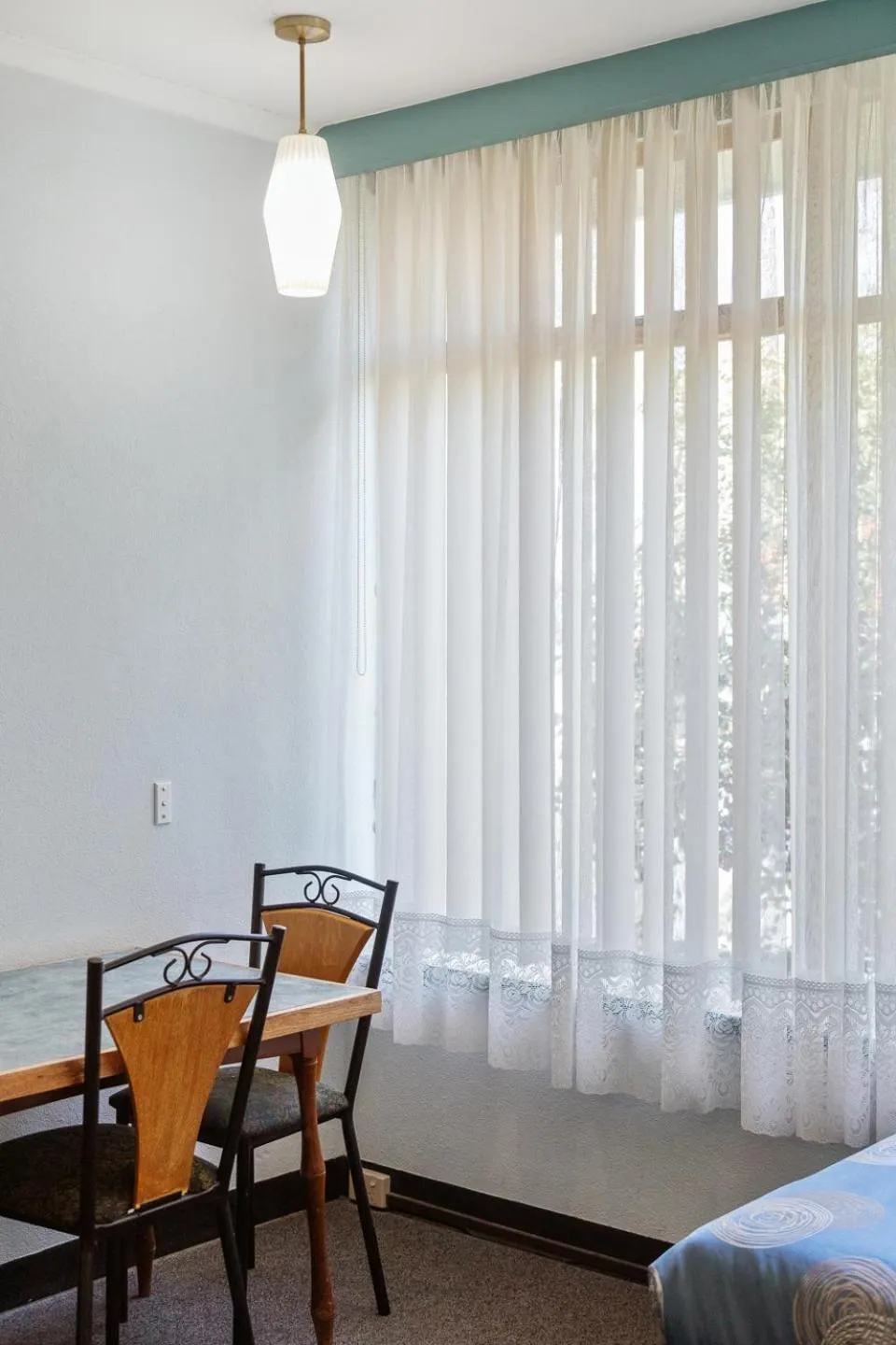 Bed in Red Carpet Motel