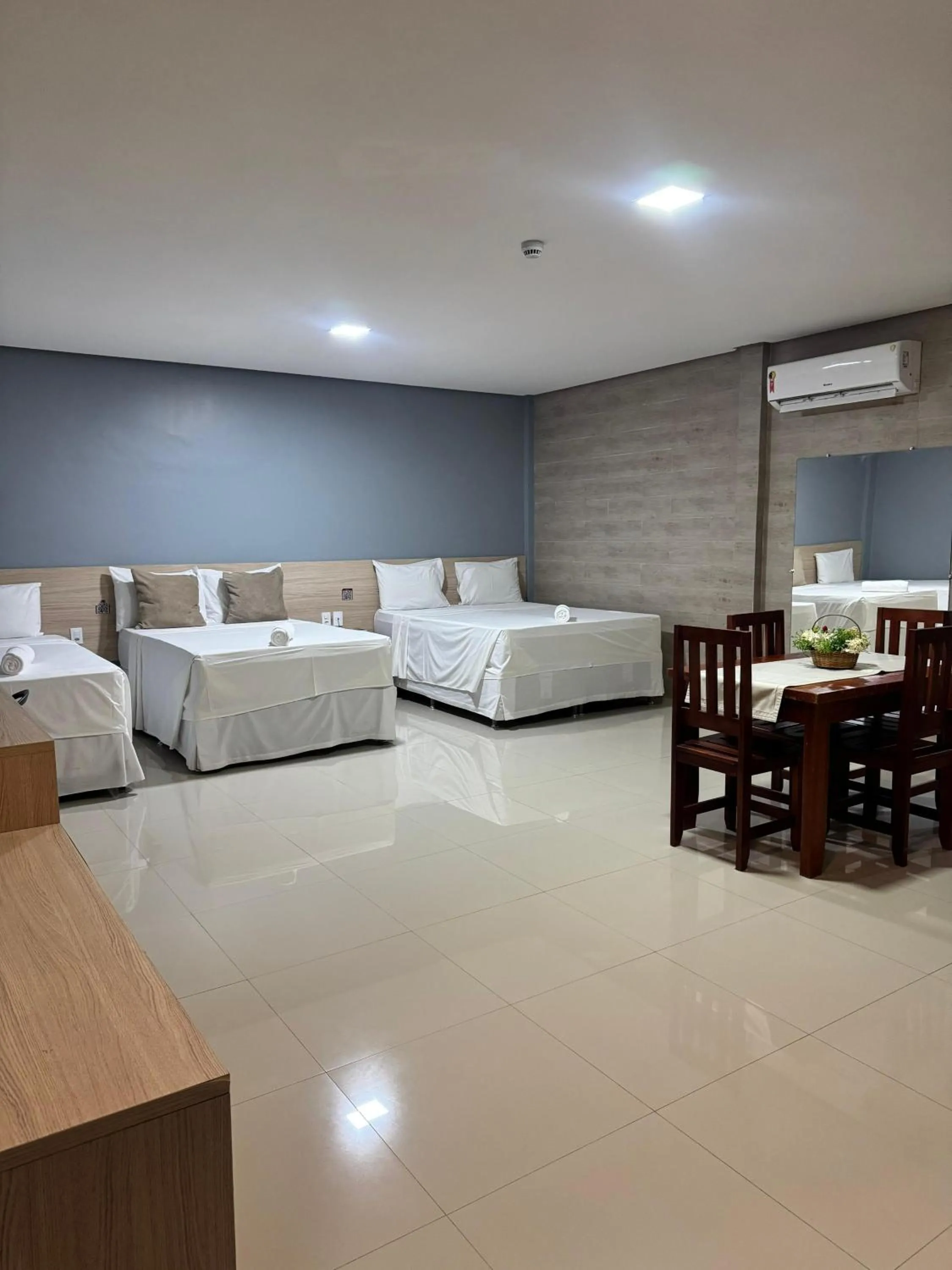Bed in INACIO'S PLAZA HOTEL