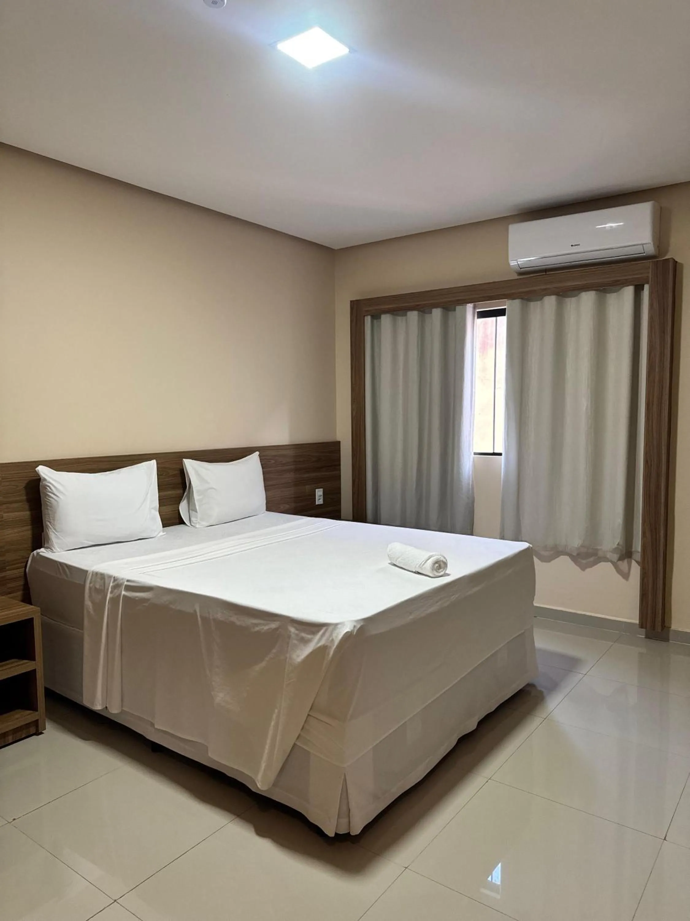Bed in INACIO'S PLAZA HOTEL