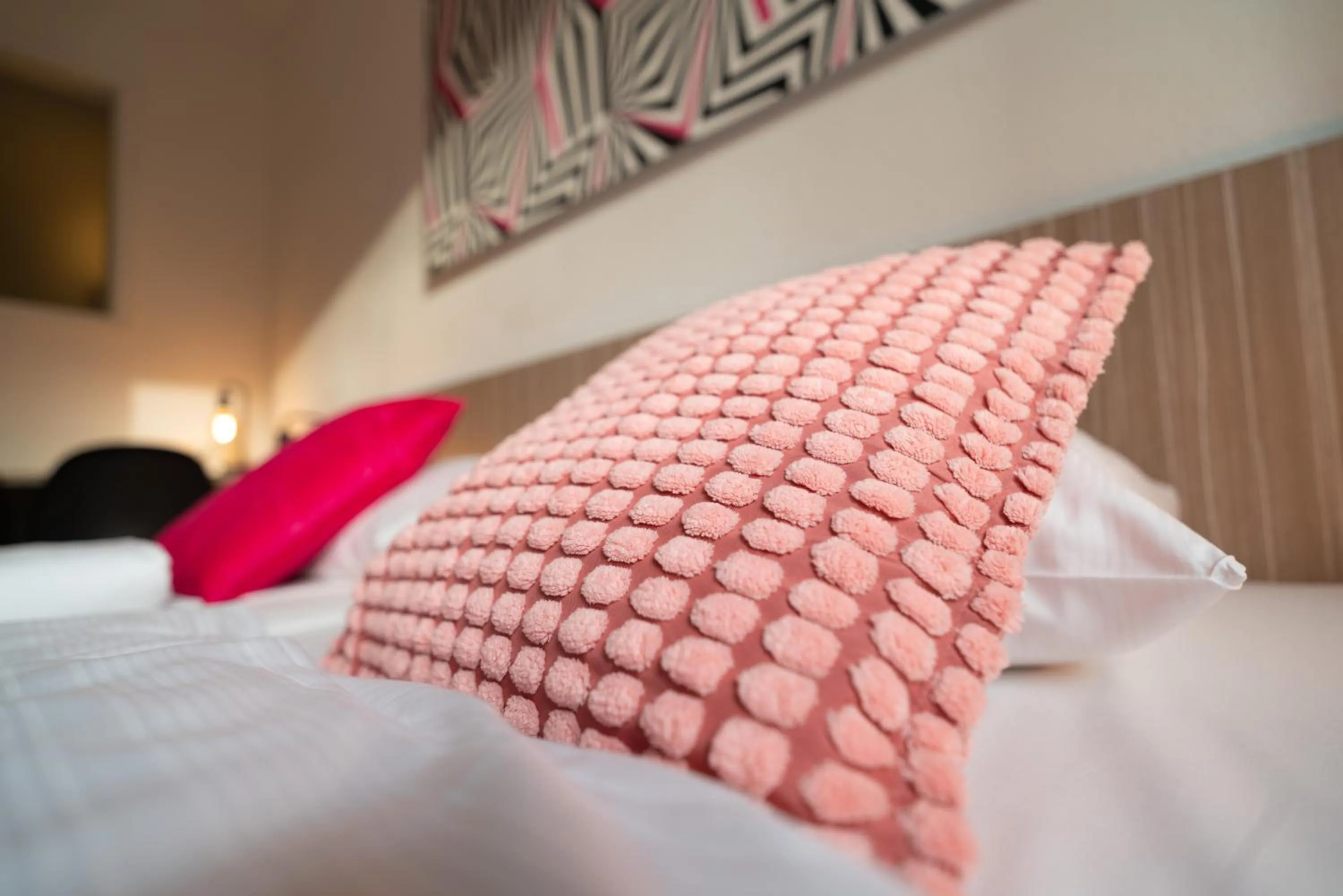 Bed in Hotel Madeleine Biohotel