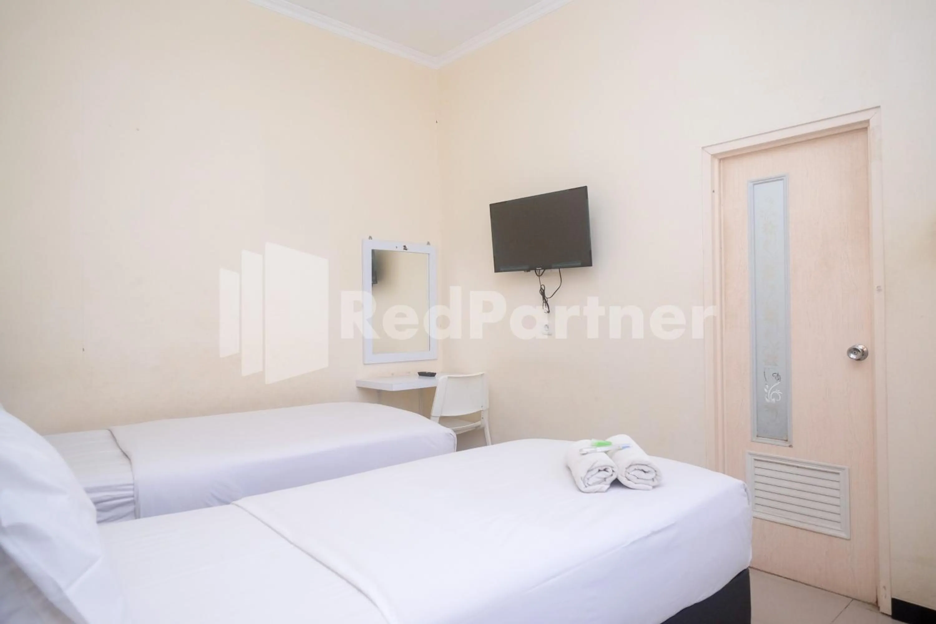 Bed in Griya Loka 2 Syariah Near Simpang Lima Mitra Reddoorz