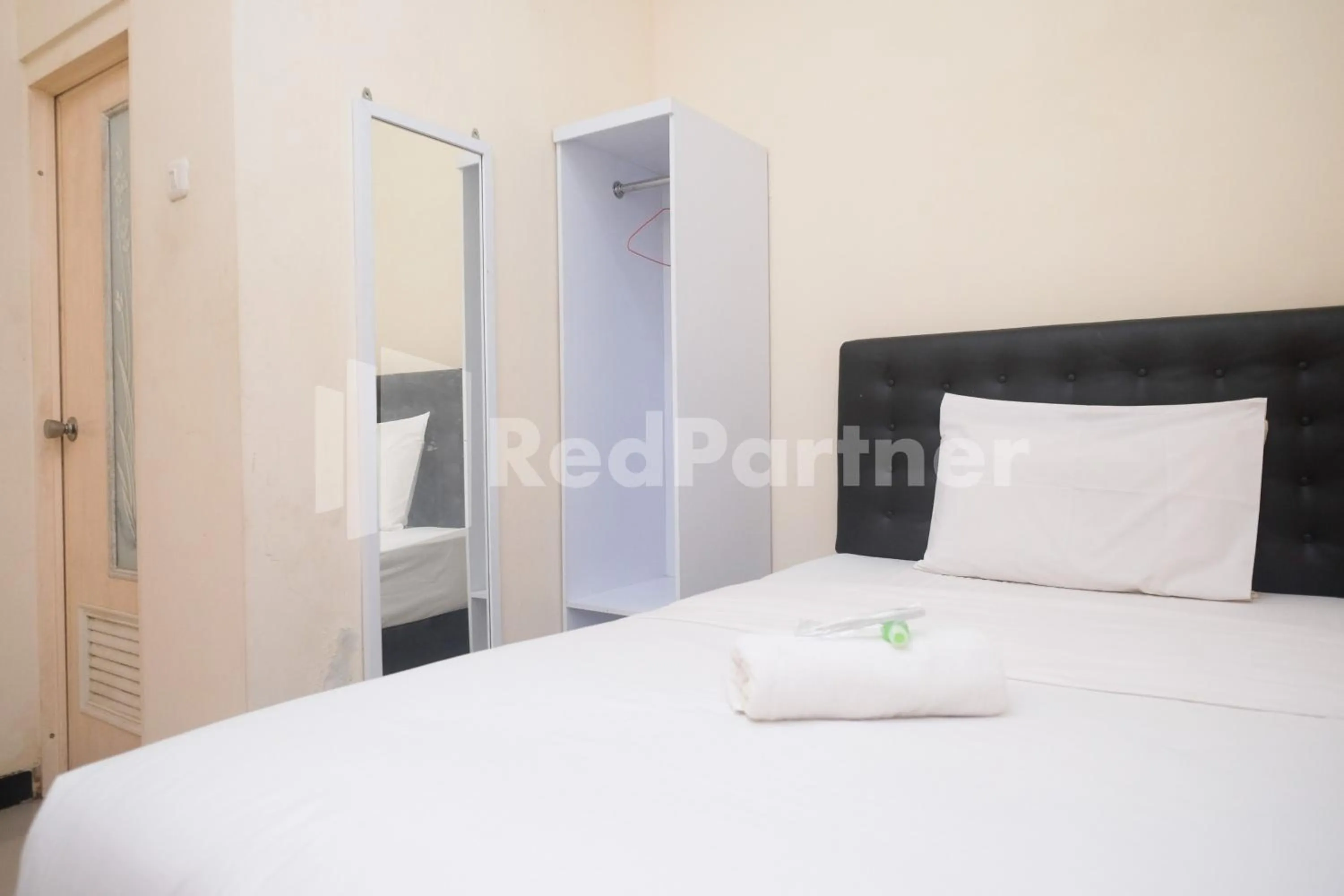 Bed in Griya Loka 2 Syariah Near Simpang Lima Mitra Reddoorz