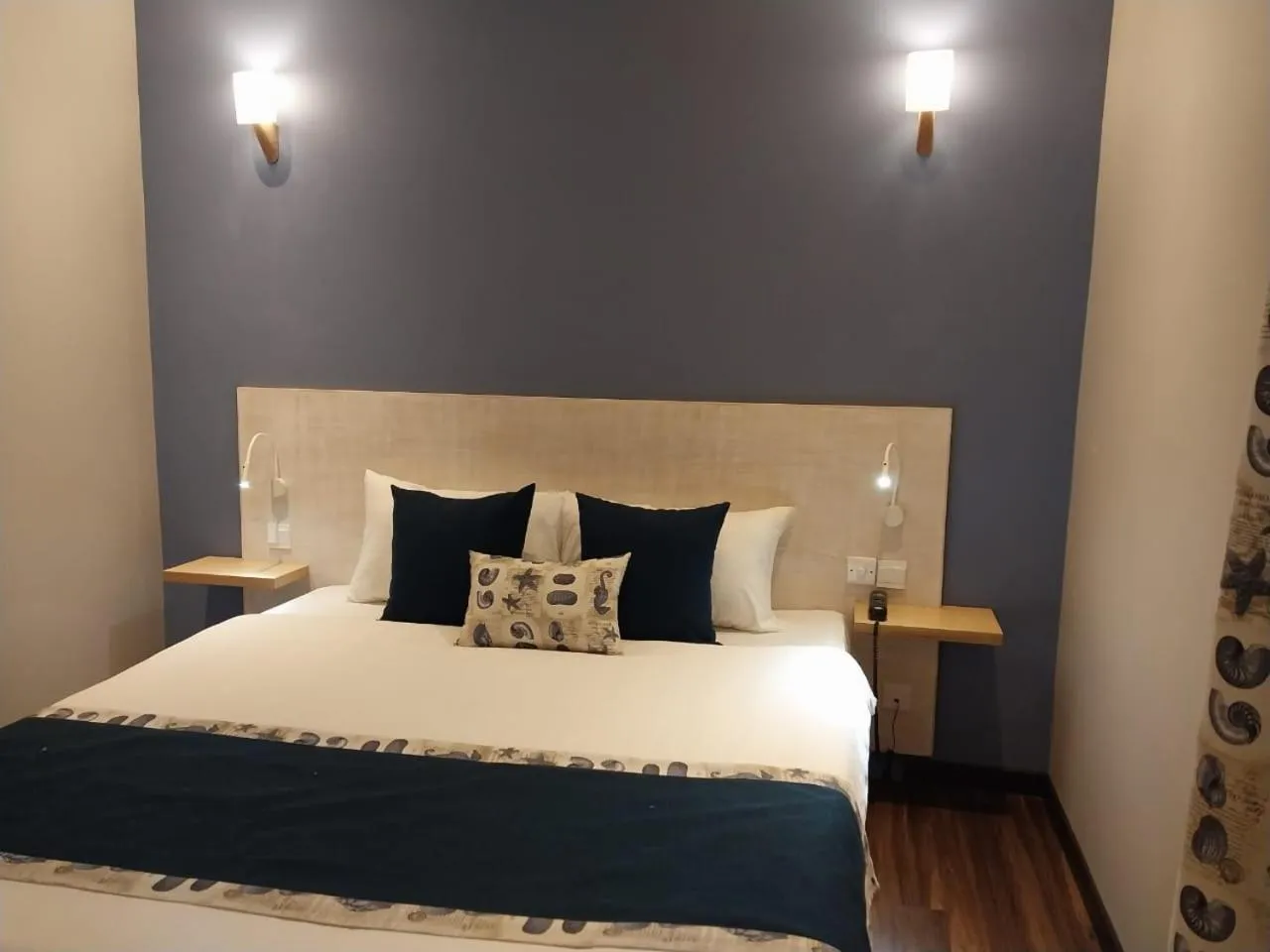 Bed in Le Grand Bleu Hotel