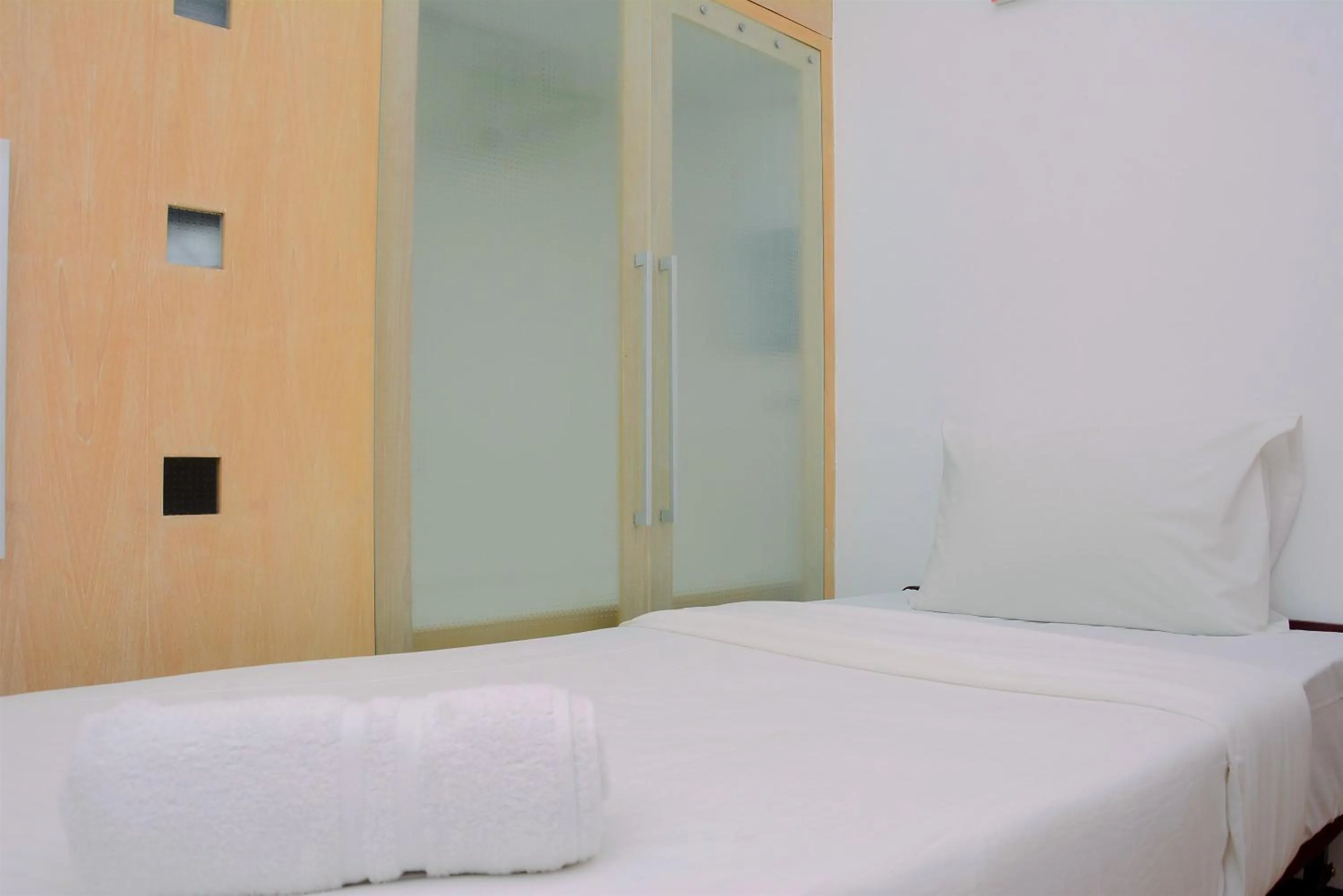 Bed in Comfortable 2BR Apartment at Mediterania Palace Residence By Travelio