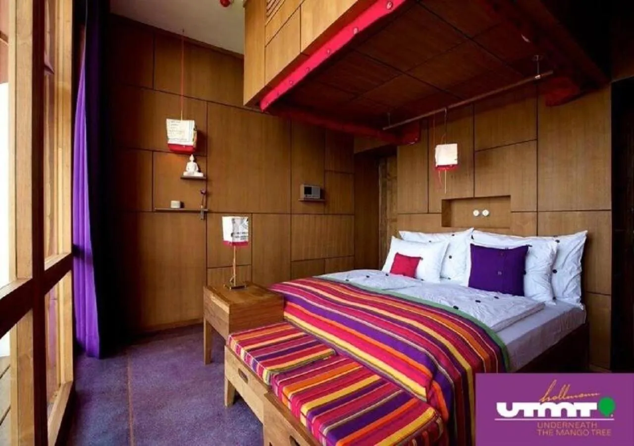 Bed in UTMT - Underneath The Mango Tree Spa & Beach Resort