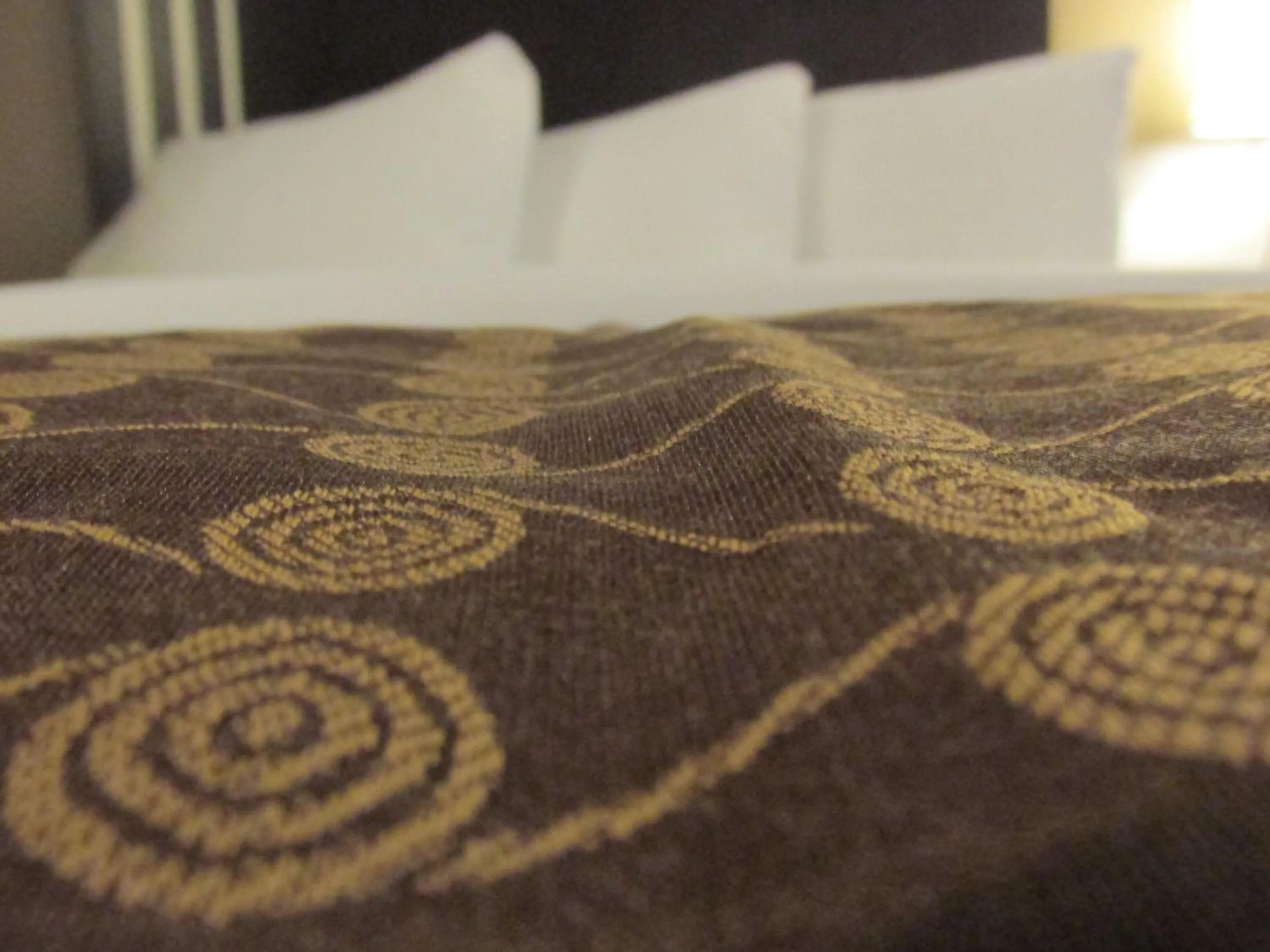 Bed in Sigma Inn & Suites