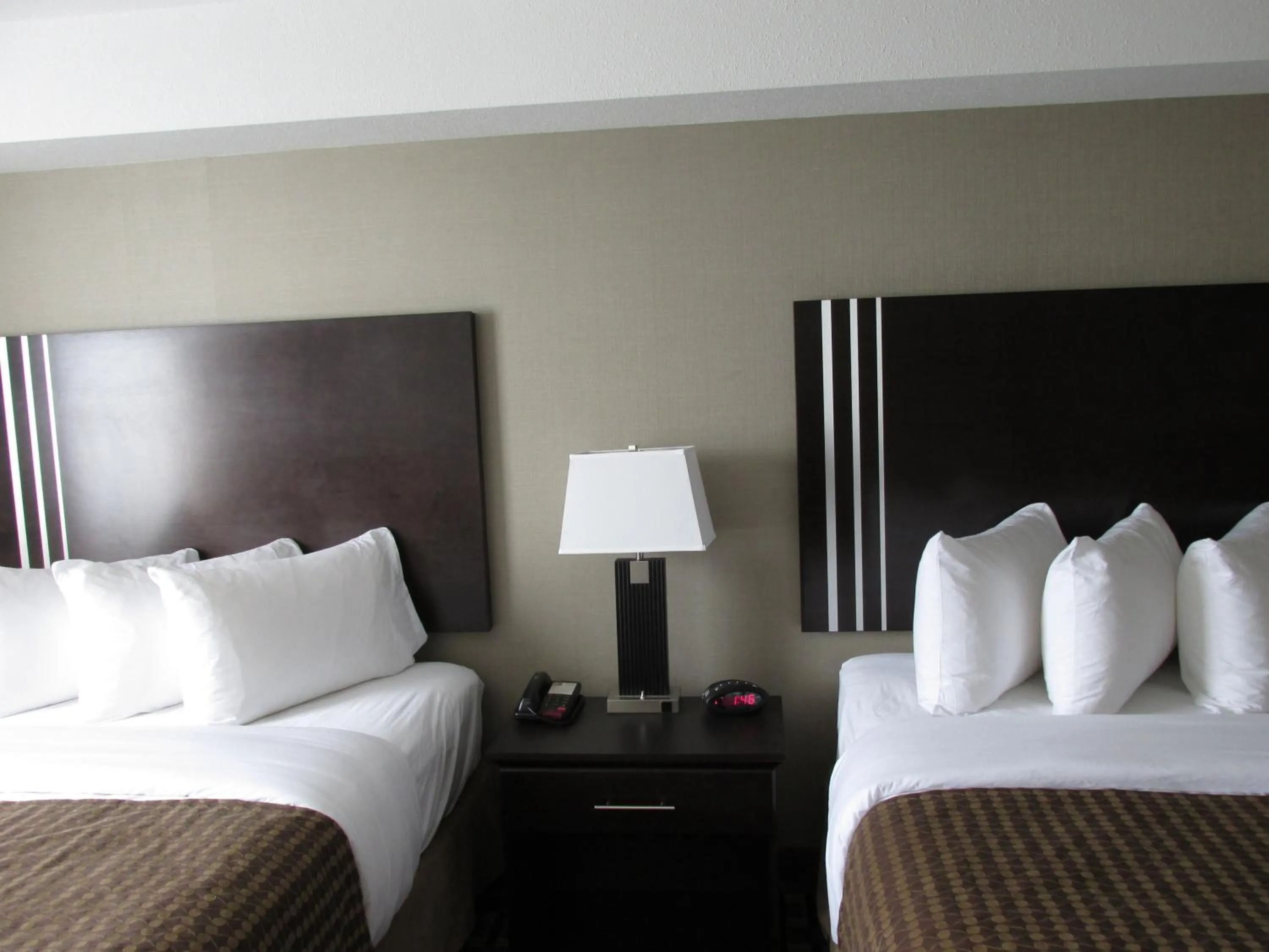 Bed in Sigma Inn & Suites