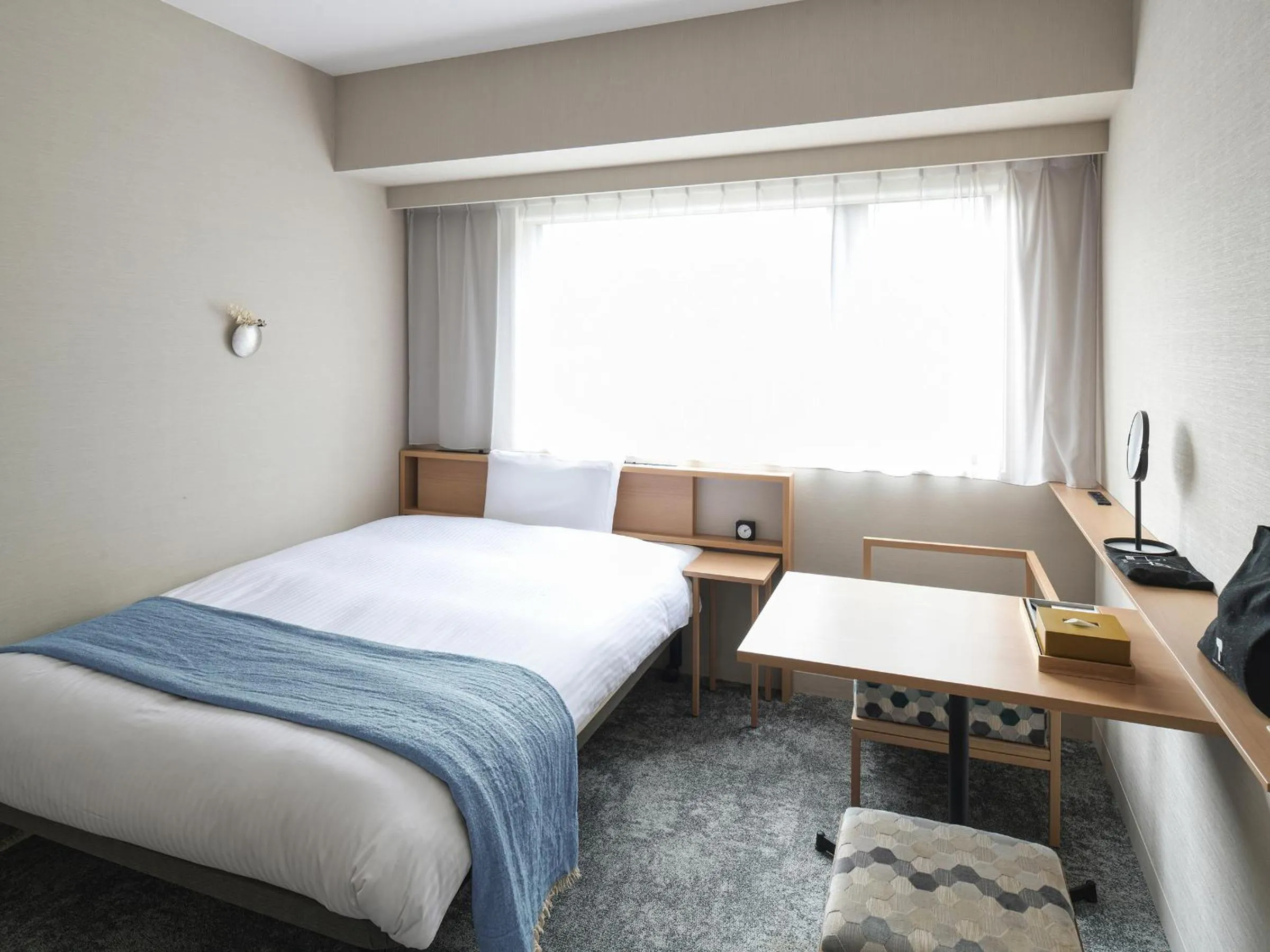 Bed in REF Kyoto Hachijoguchi by VESSEL HOTELS