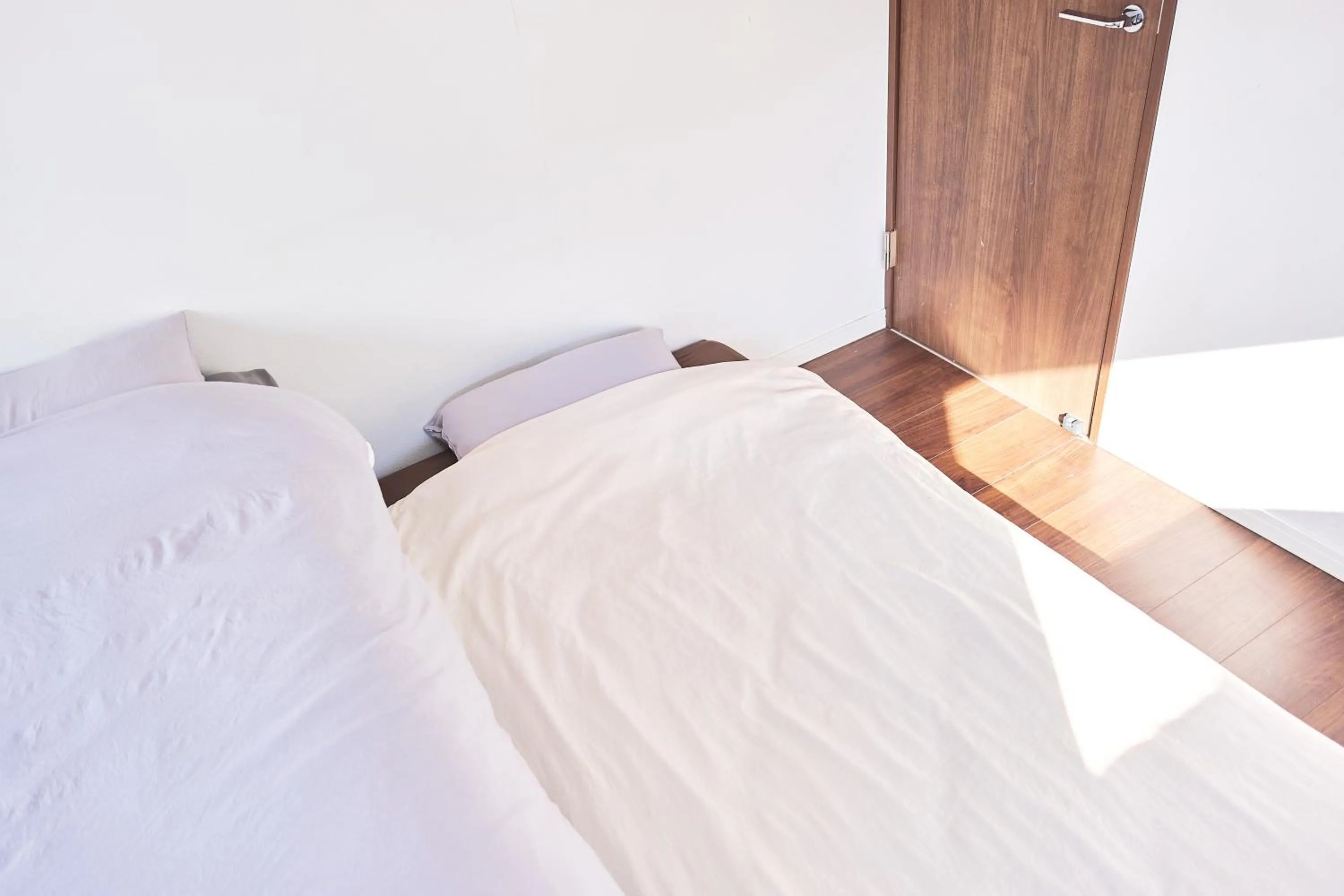 Bed in Base Hanegi Apartment by Tranova