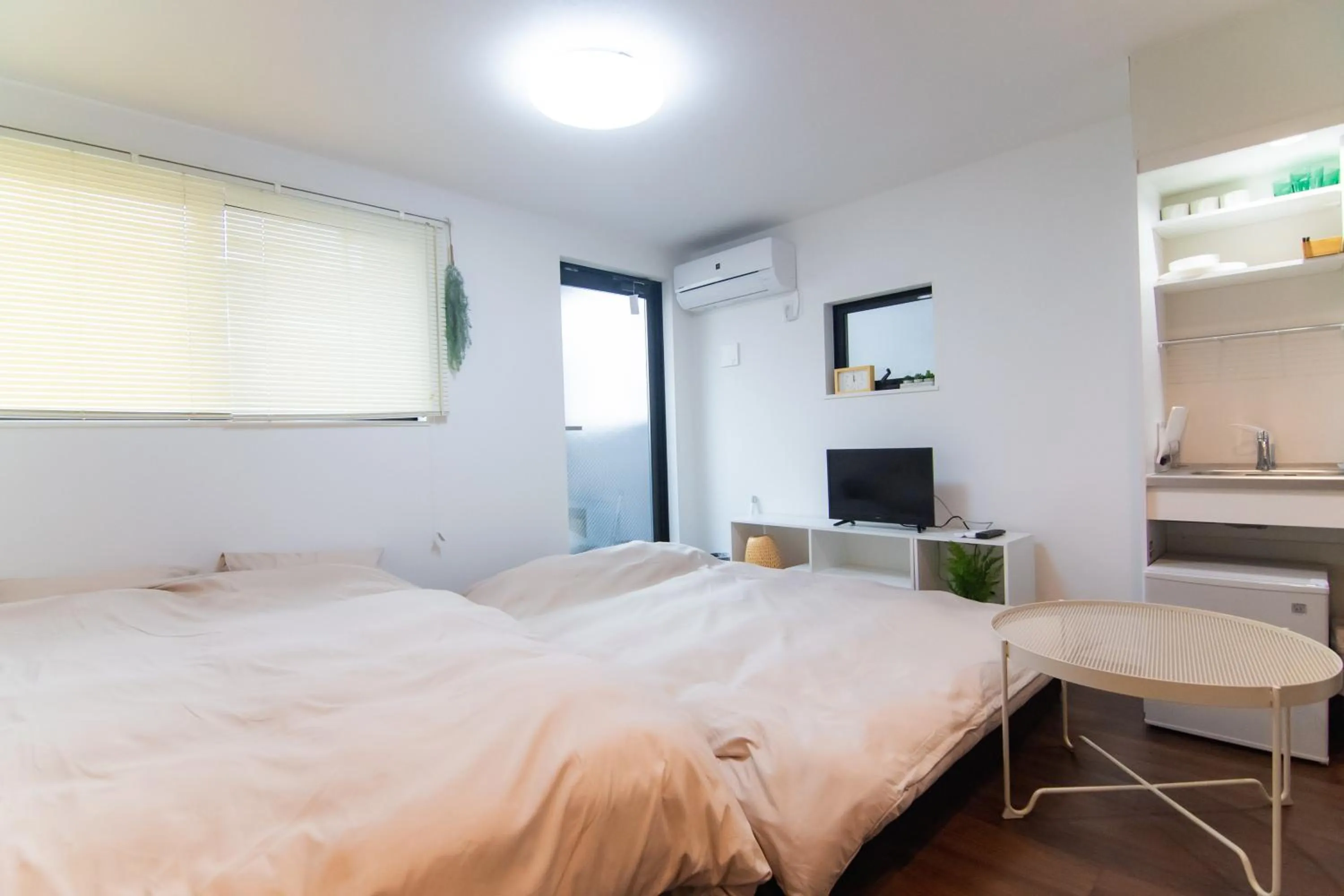 Bed in Base Hanegi Apartment by Tranova