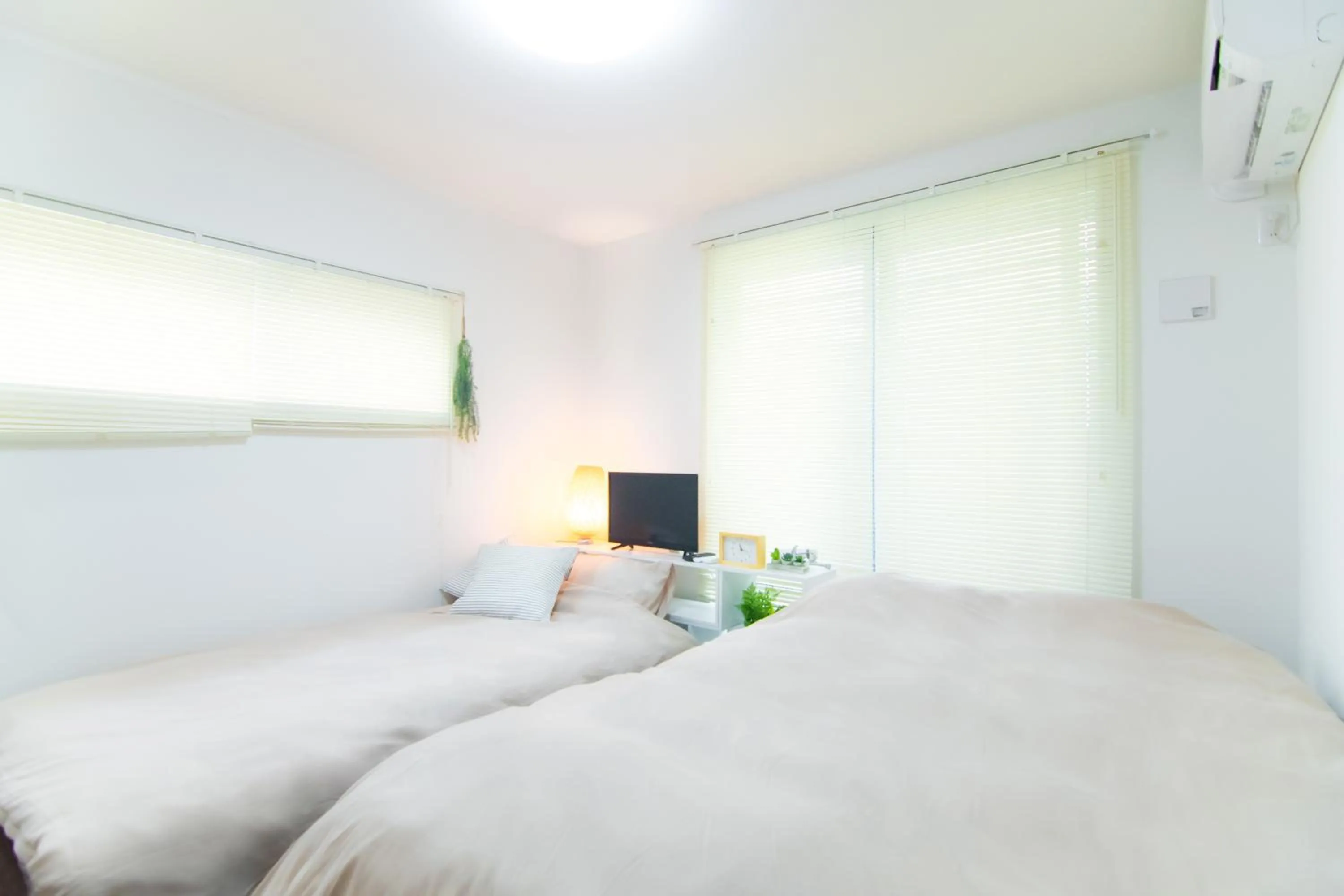 Bed in Base Hanegi Apartment by Tranova