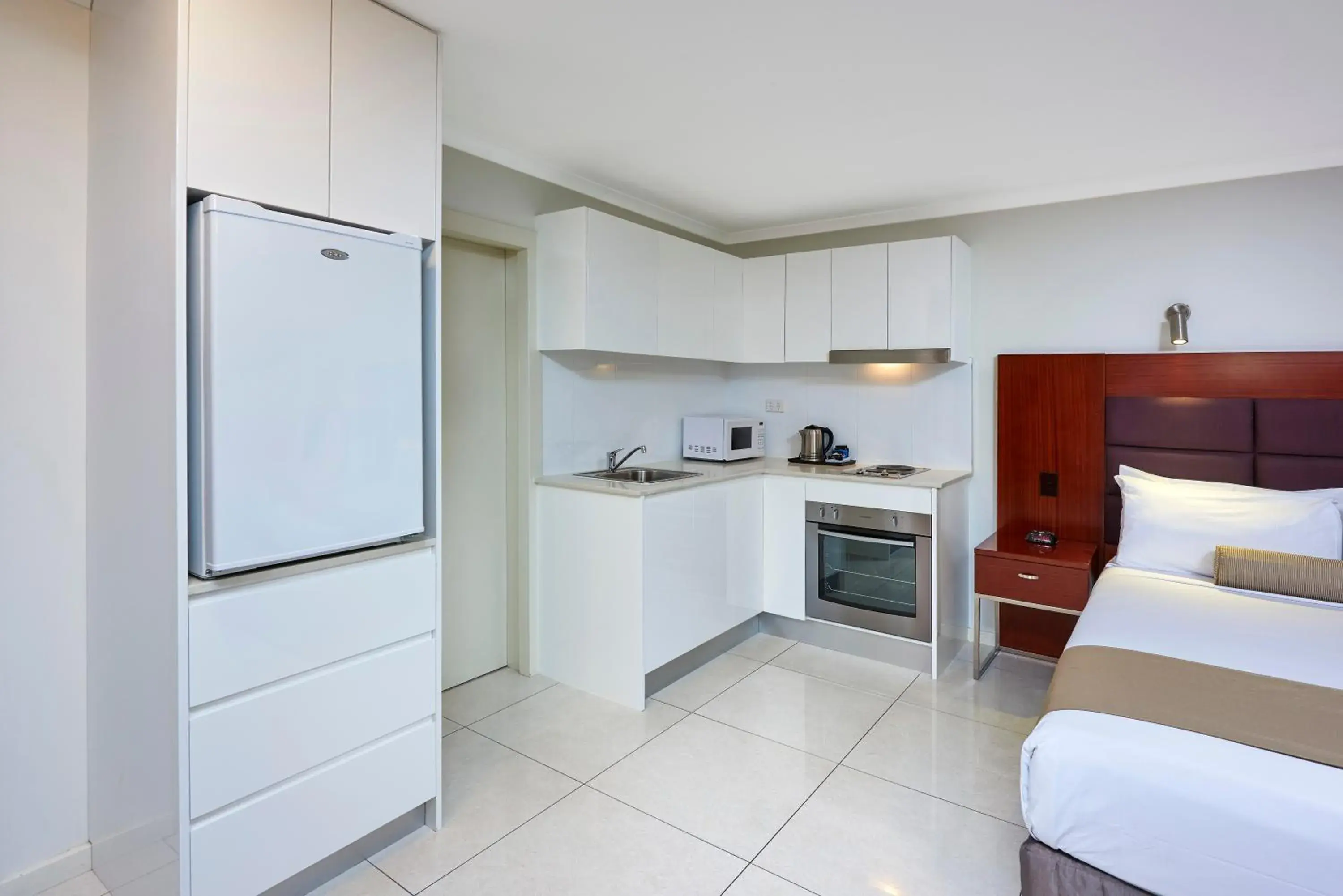 Kitchen or kitchenette, Bed in Best Western Casula Motor Inn Kitchen or kitchenette, Bed in Best Western Casula Motor Inn