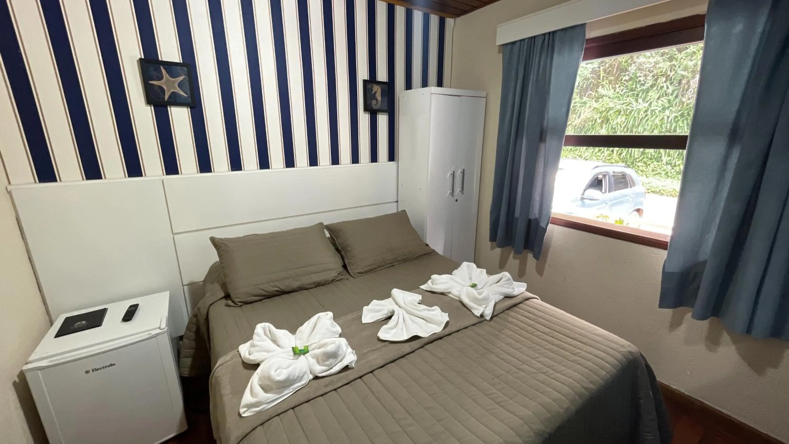 Photo of the whole room, Bed in Pousada Atalaia Capivari