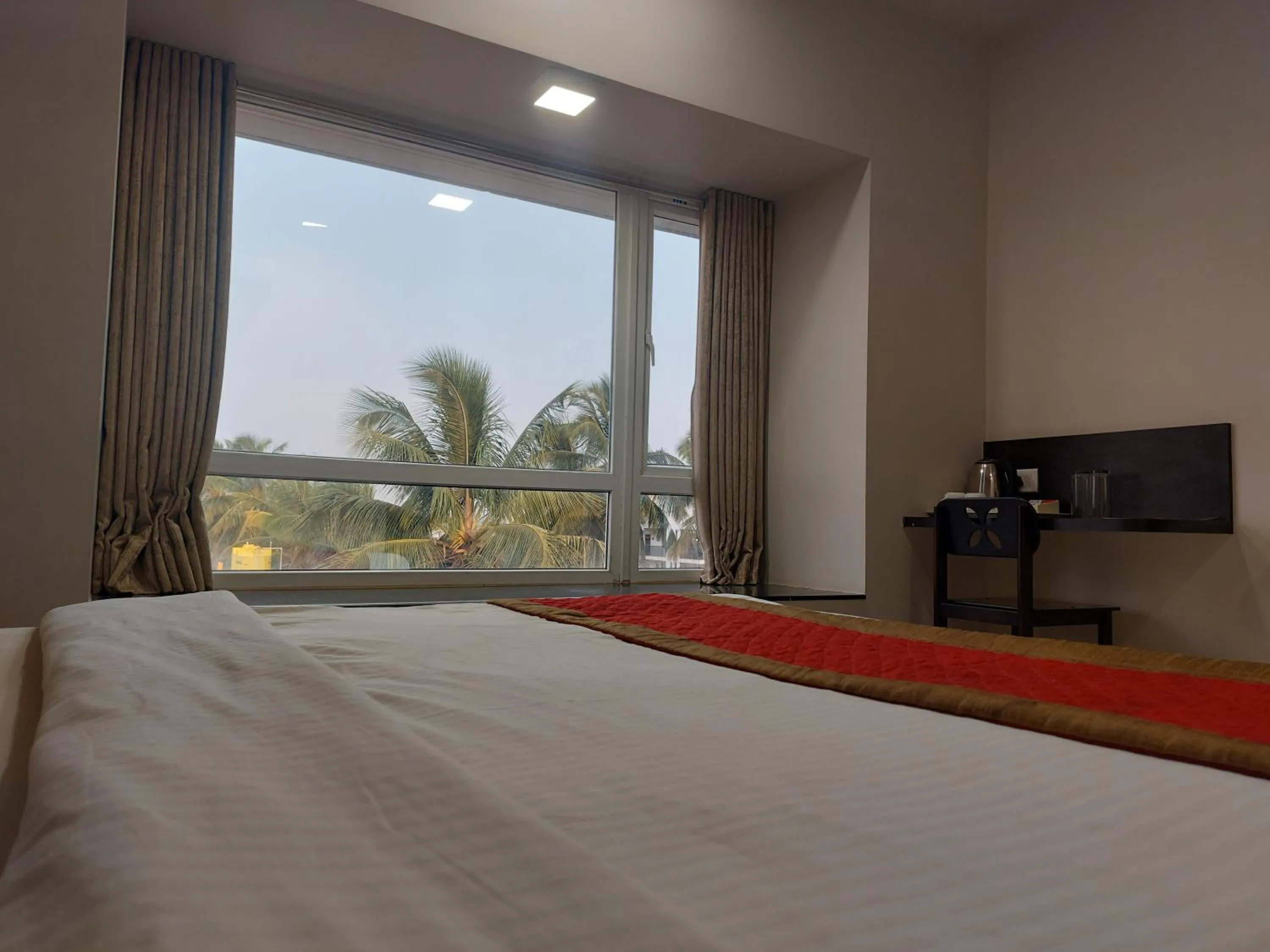 View (from property/room), Bed in Hotel Rahul Palace Belgaum