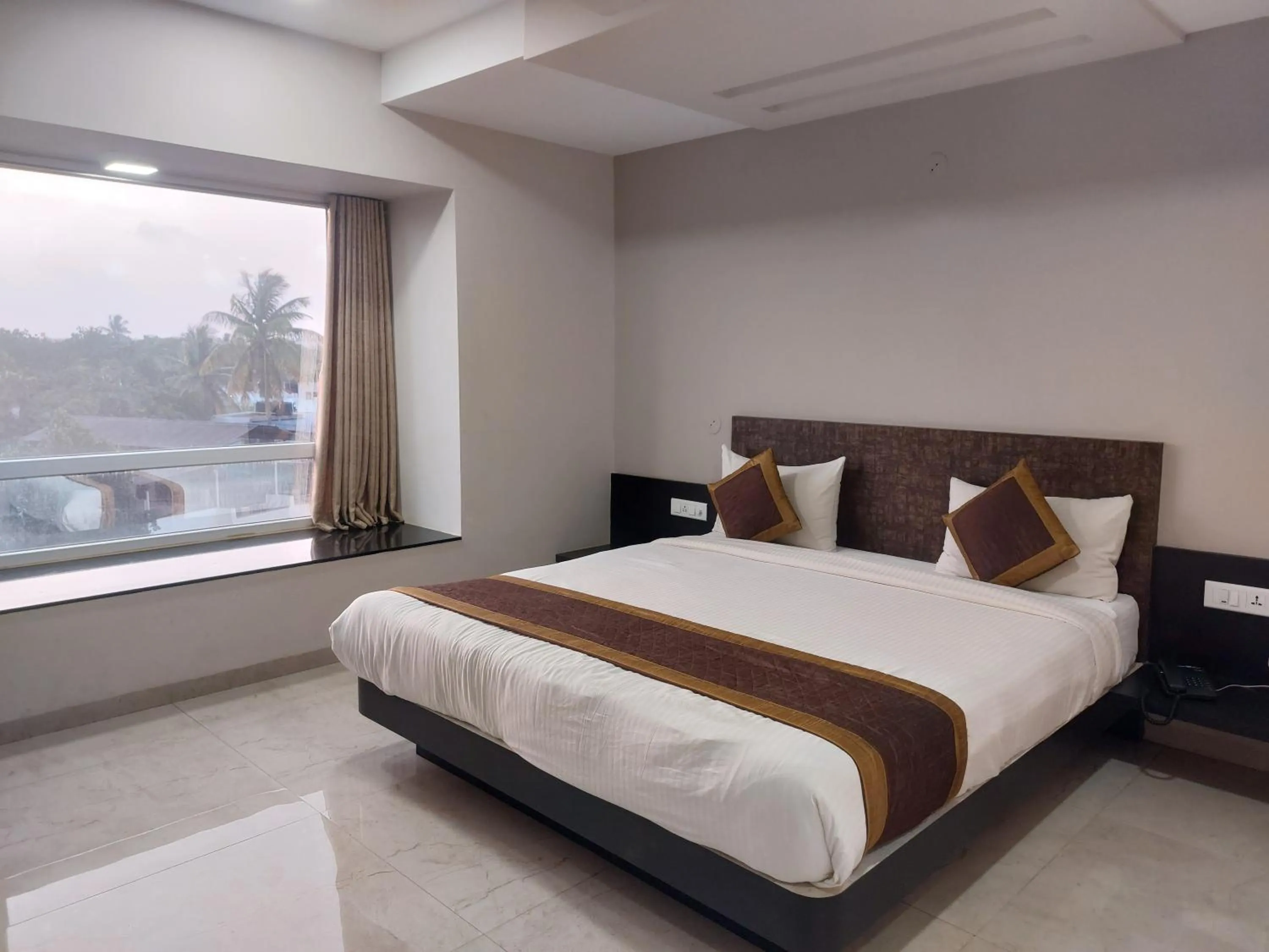 View (from property/room), Bed in Hotel Rahul Palace Belgaum