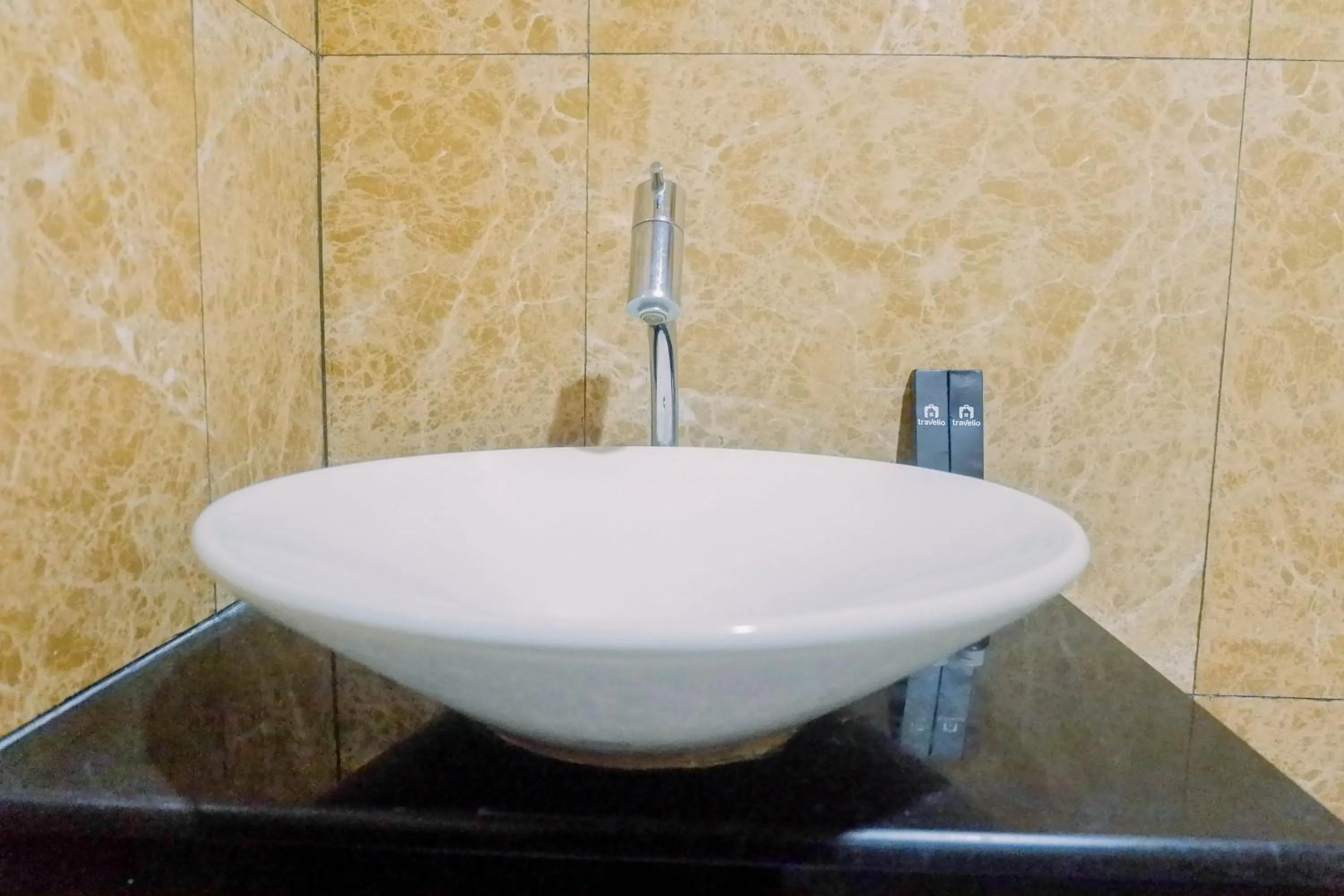 Bathroom in Lavish 2BR Apartment at Grand Sungkono Lagoon By Travelio