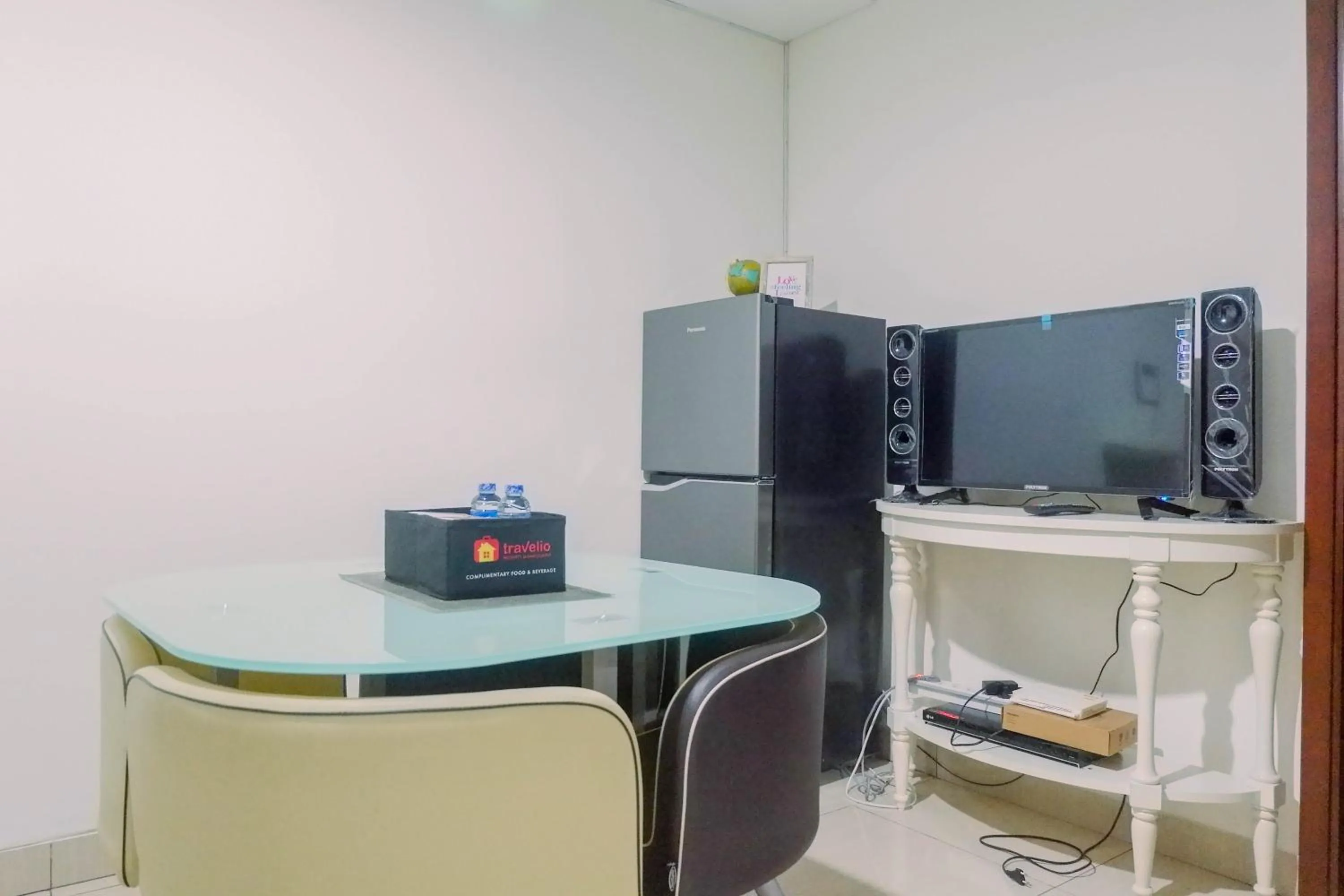 Living room in Lavish 2BR Apartment at Grand Sungkono Lagoon By Travelio