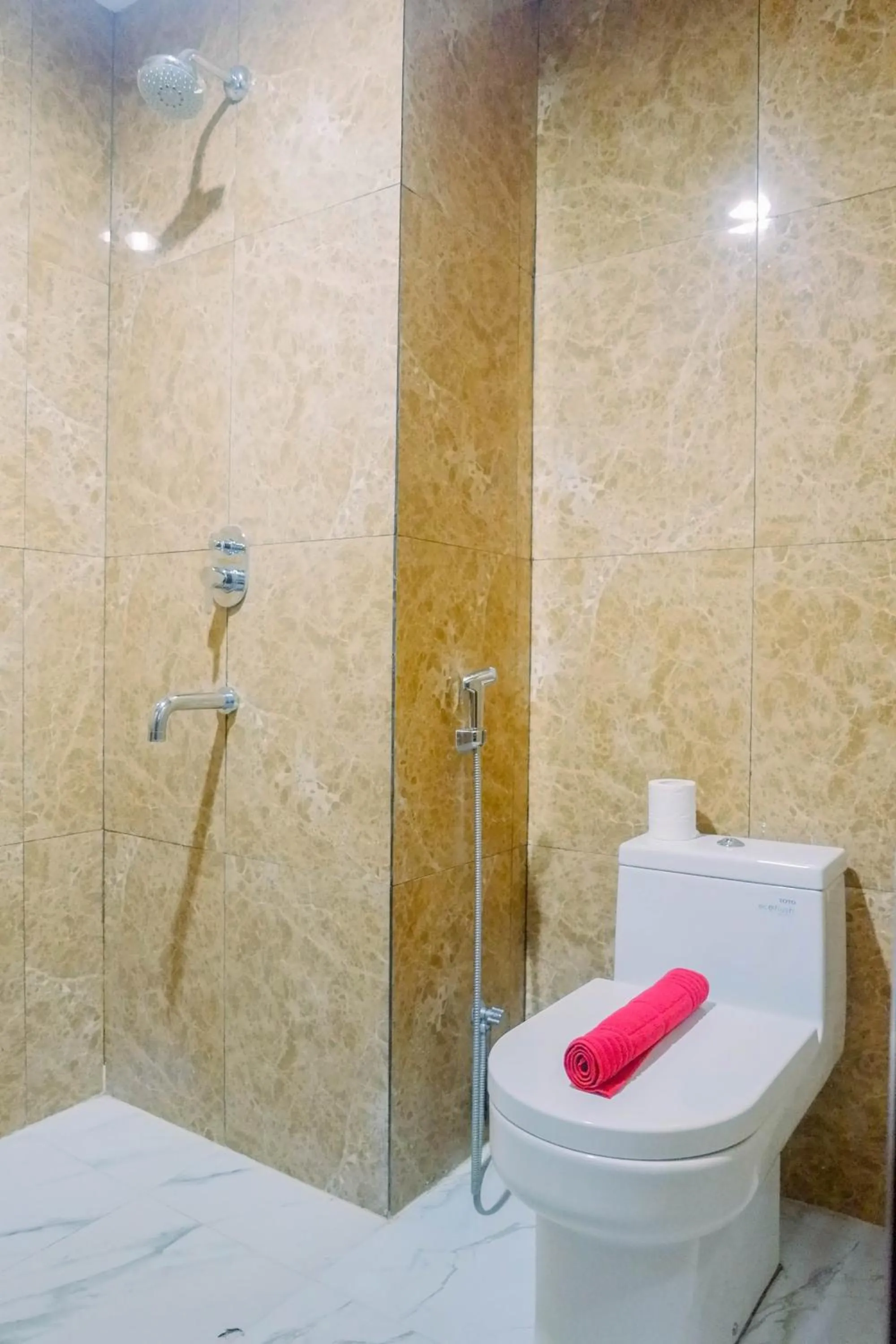 Bathroom in Lavish 2BR Apartment at Grand Sungkono Lagoon By Travelio