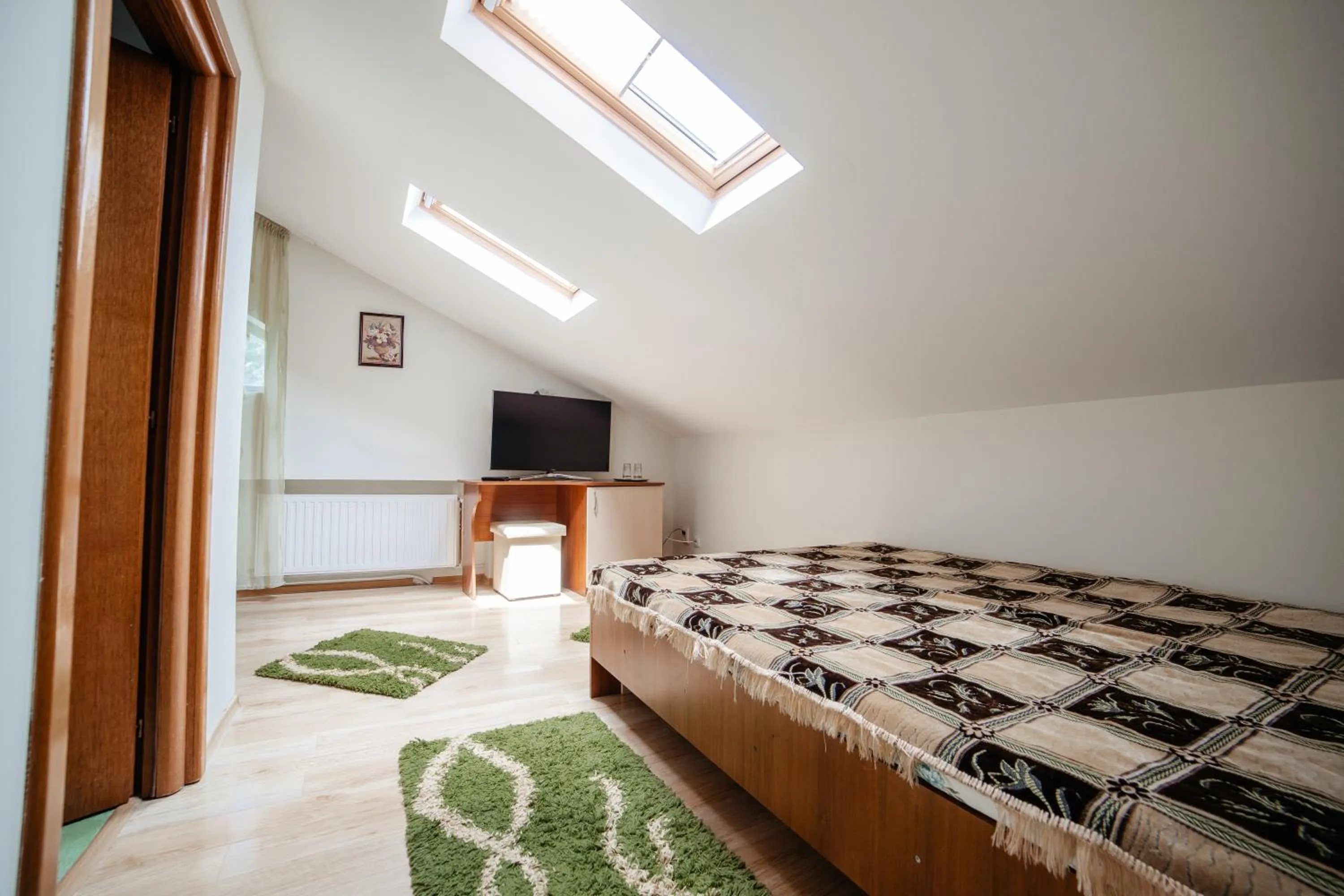 Communal lounge/ TV room in Pensiunea Floare de Colţ