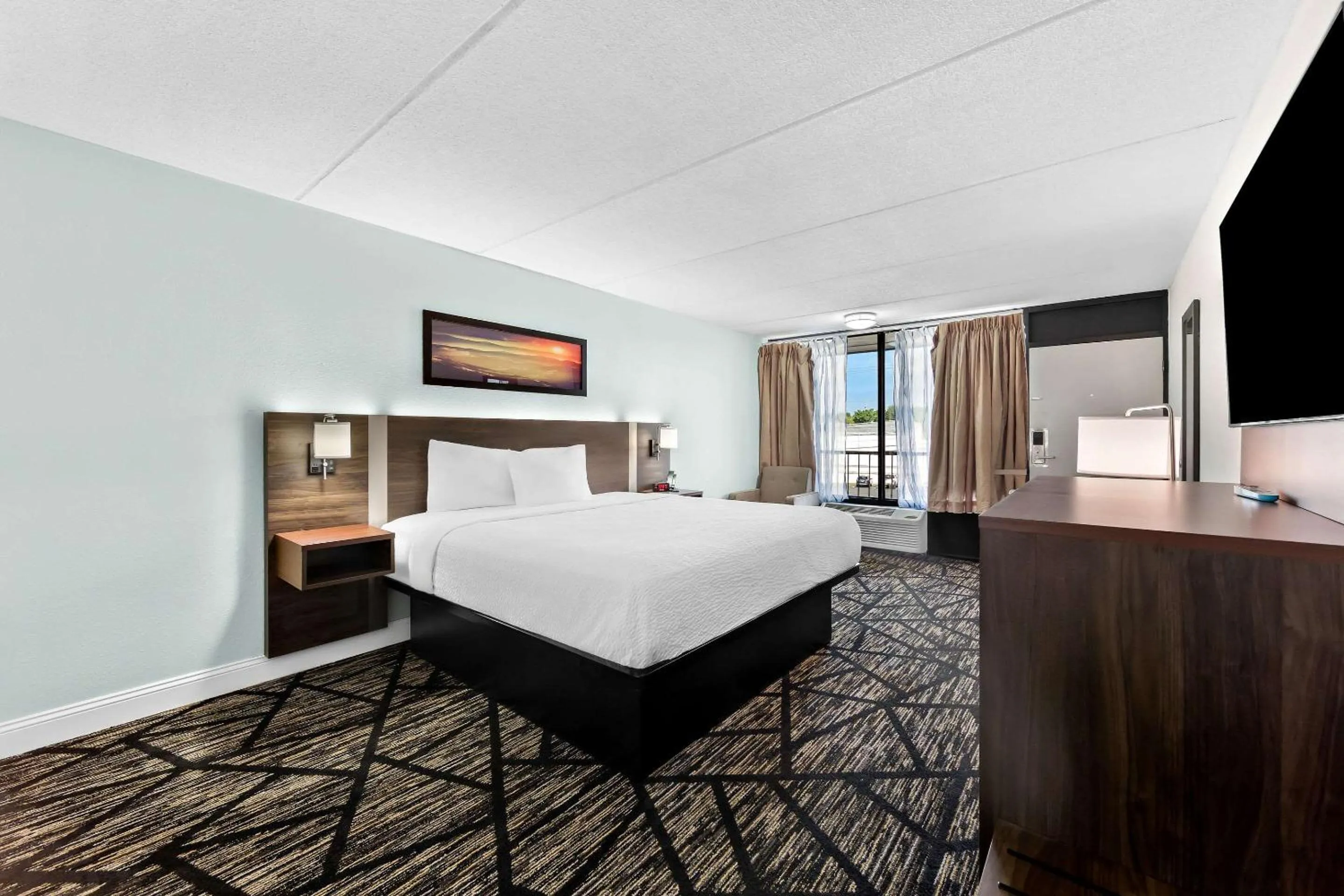 Bedroom, Bed in Days Inn & Suites by Wyndham Pigeon Forge