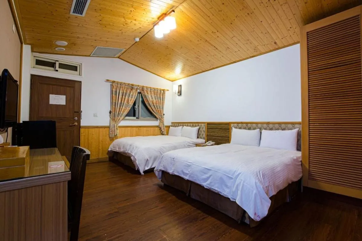 Bed in Dragon Manor Resort