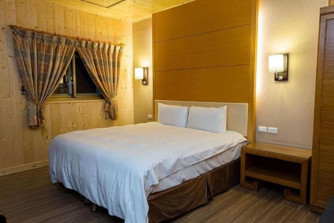 Bed in Dragon Manor Resort