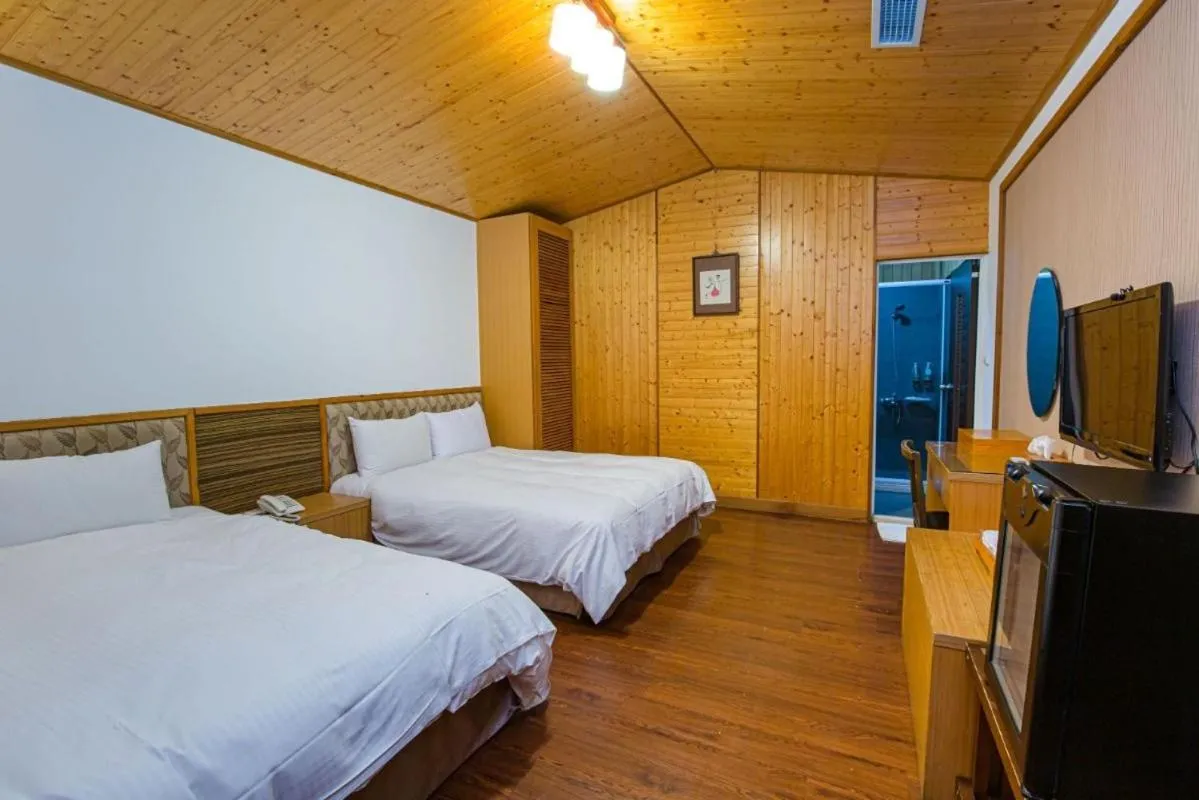 Bed in Dragon Manor Resort