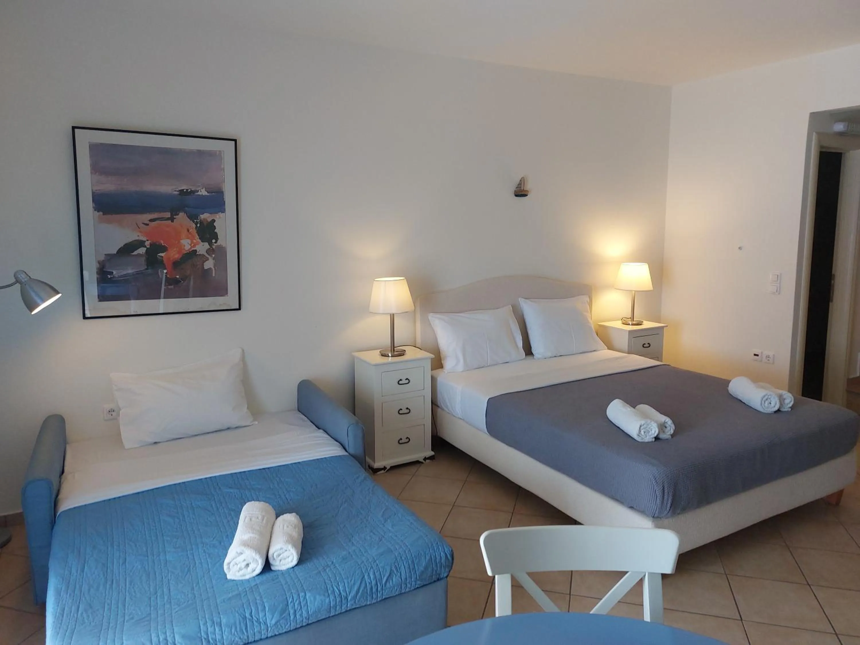 Bed in PLEIADES lUXURY APARTMENTS