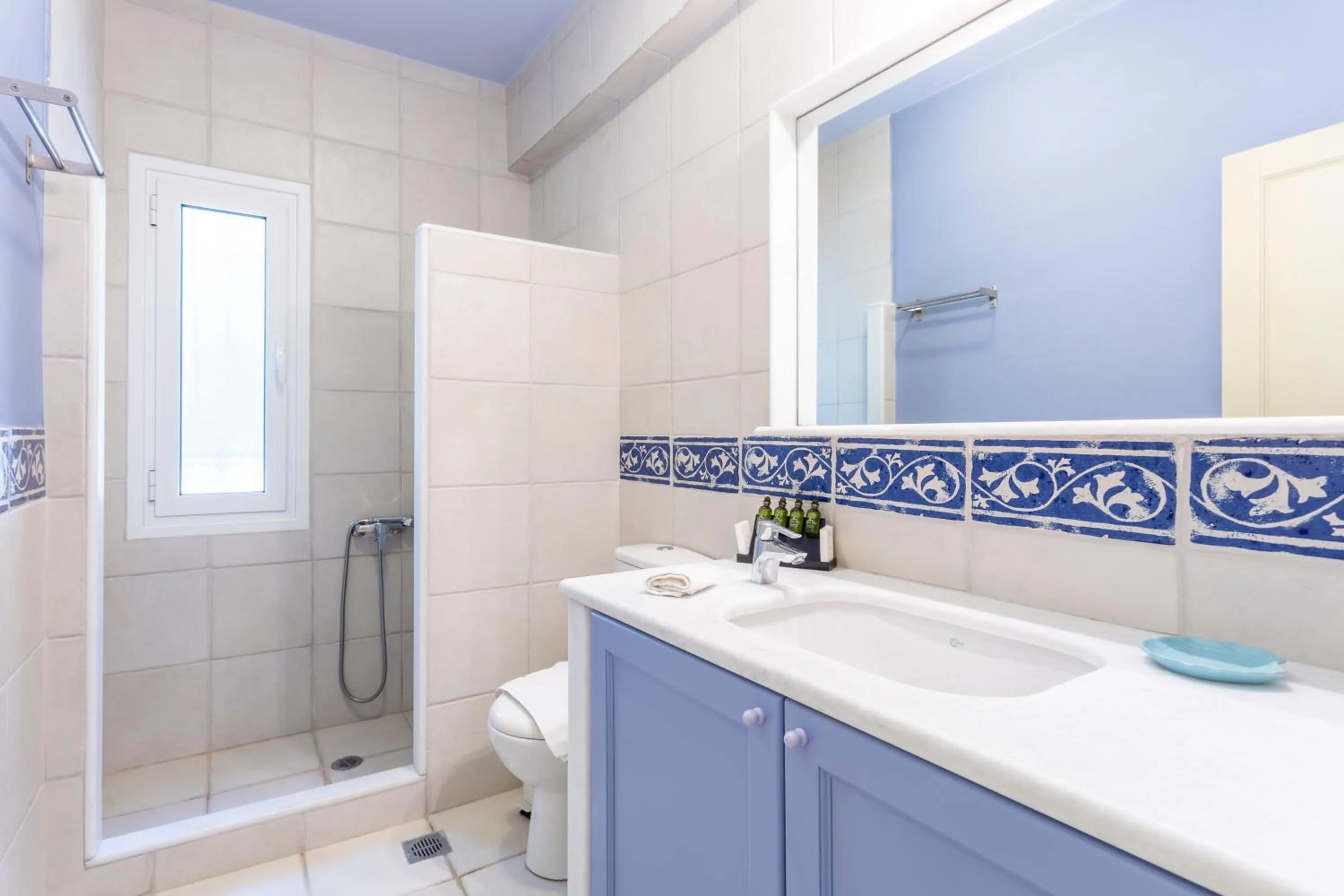 Shower in PLEIADES lUXURY APARTMENTS