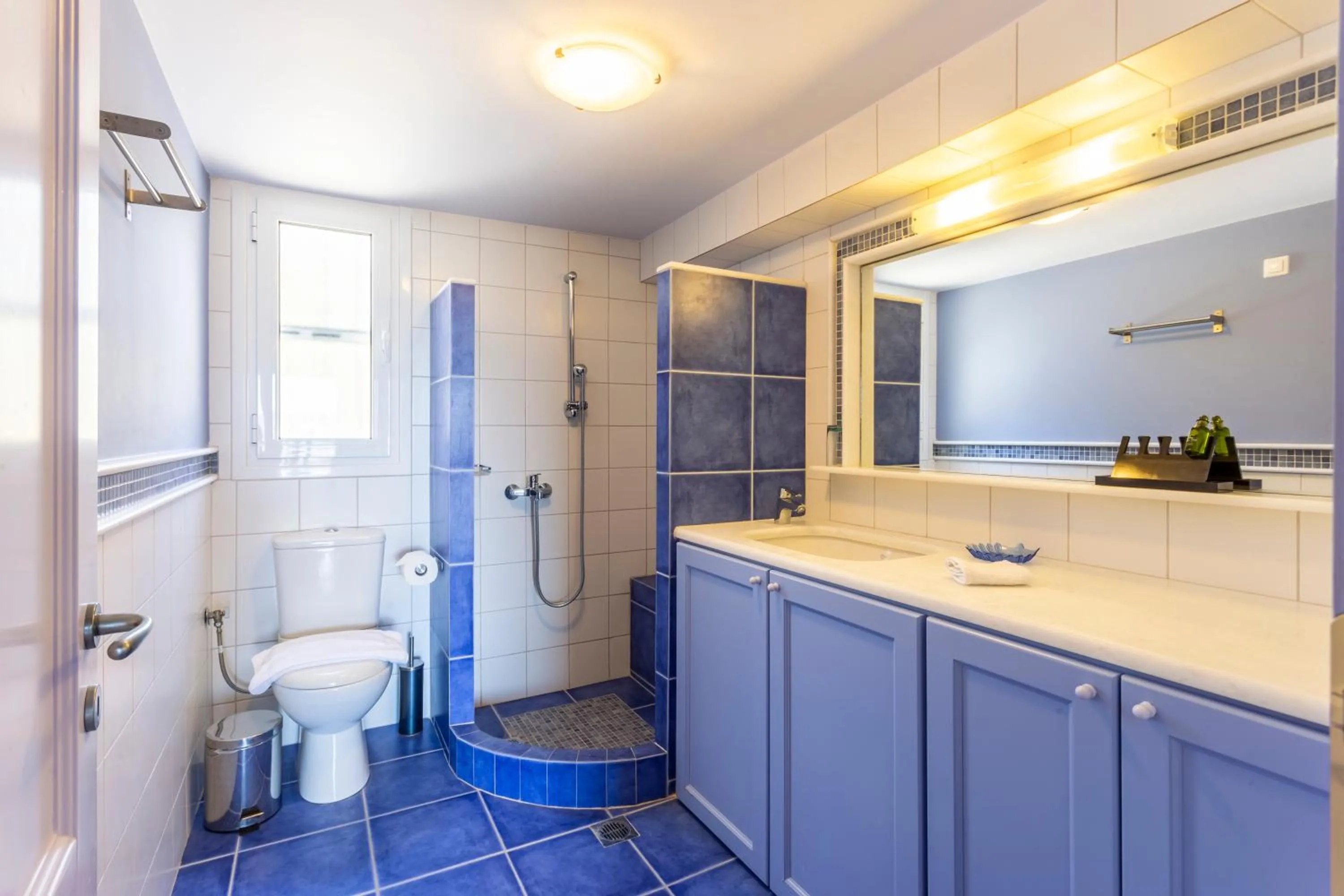 Shower in PLEIADES lUXURY APARTMENTS