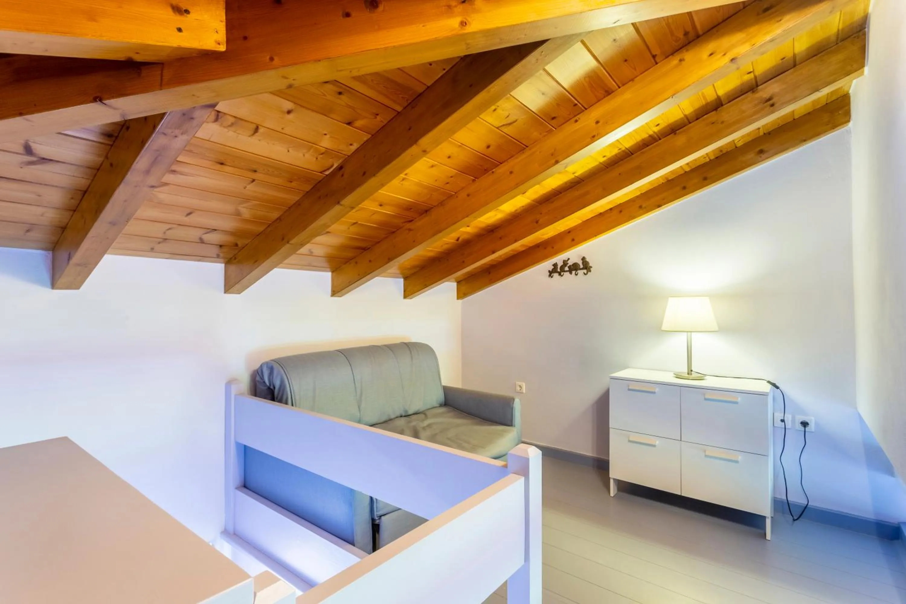 Bed in PLEIADES lUXURY APARTMENTS