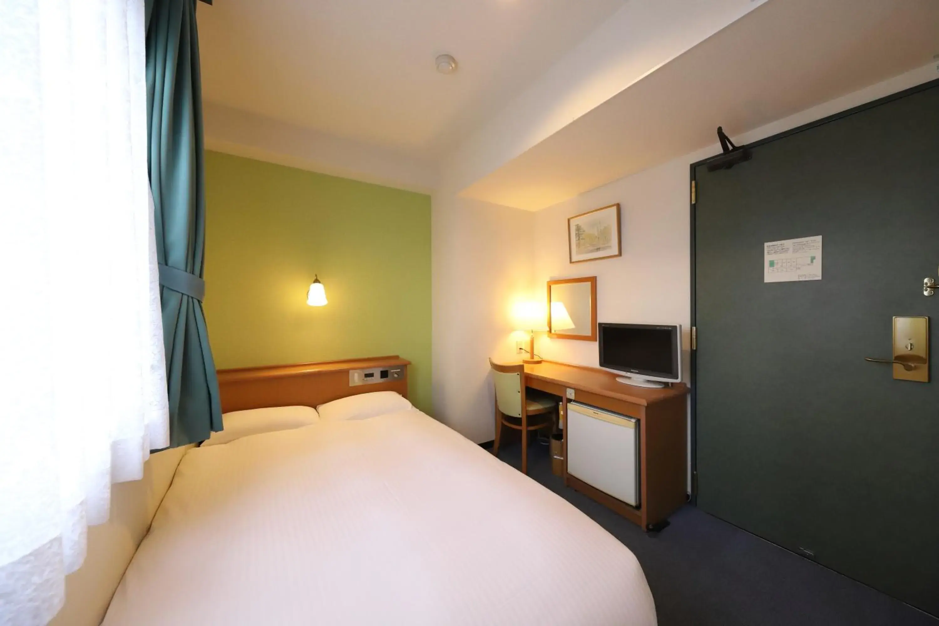 Bed in Smile Hotel Takaoka Ekimae Bed in Smile Hotel Takaoka Ekimae