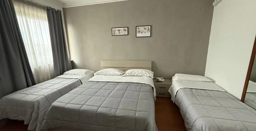 Bed in HOTEL QUADRIFOGLIO