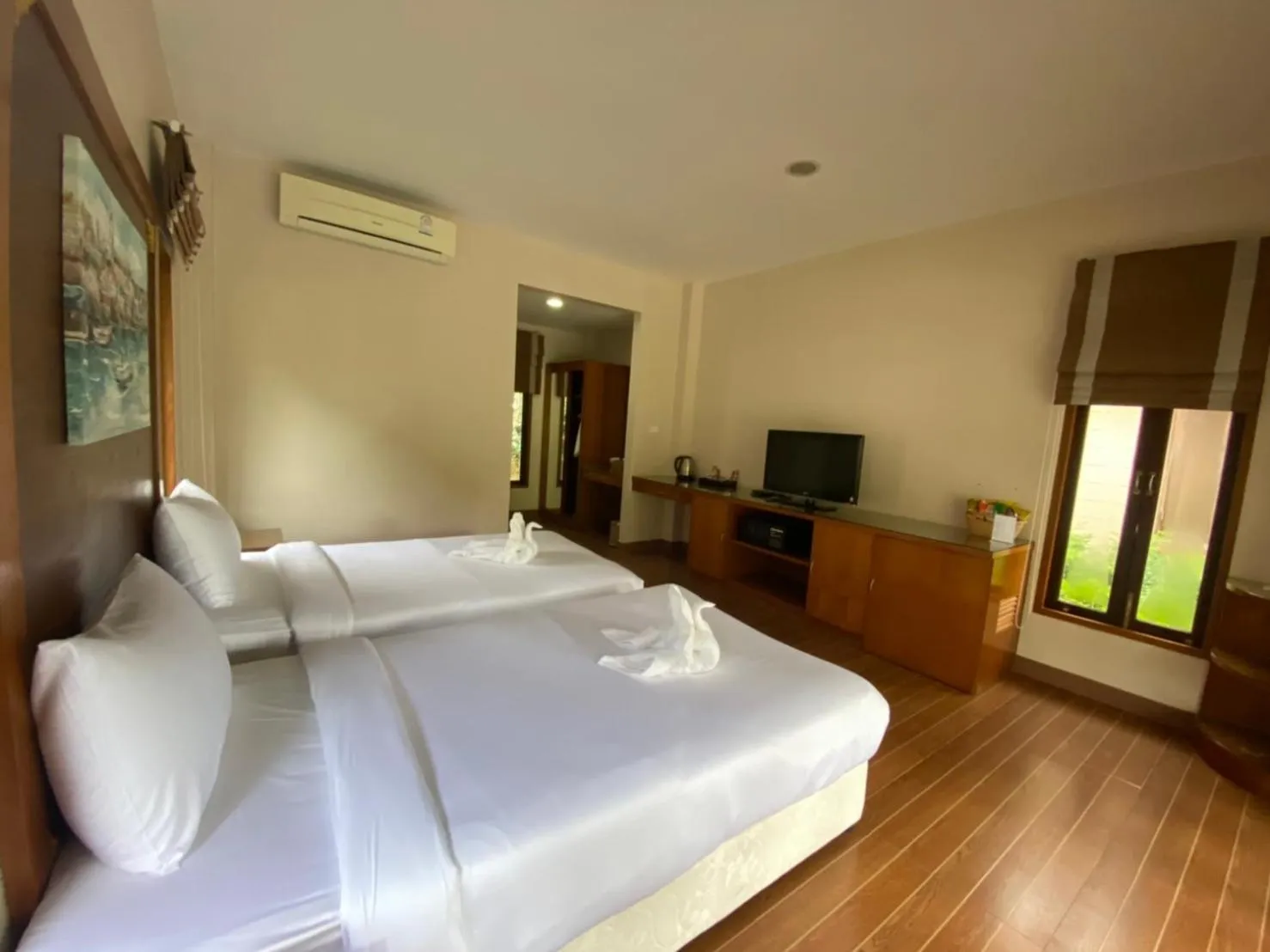 Bed in Chaithalay Khanom Resort