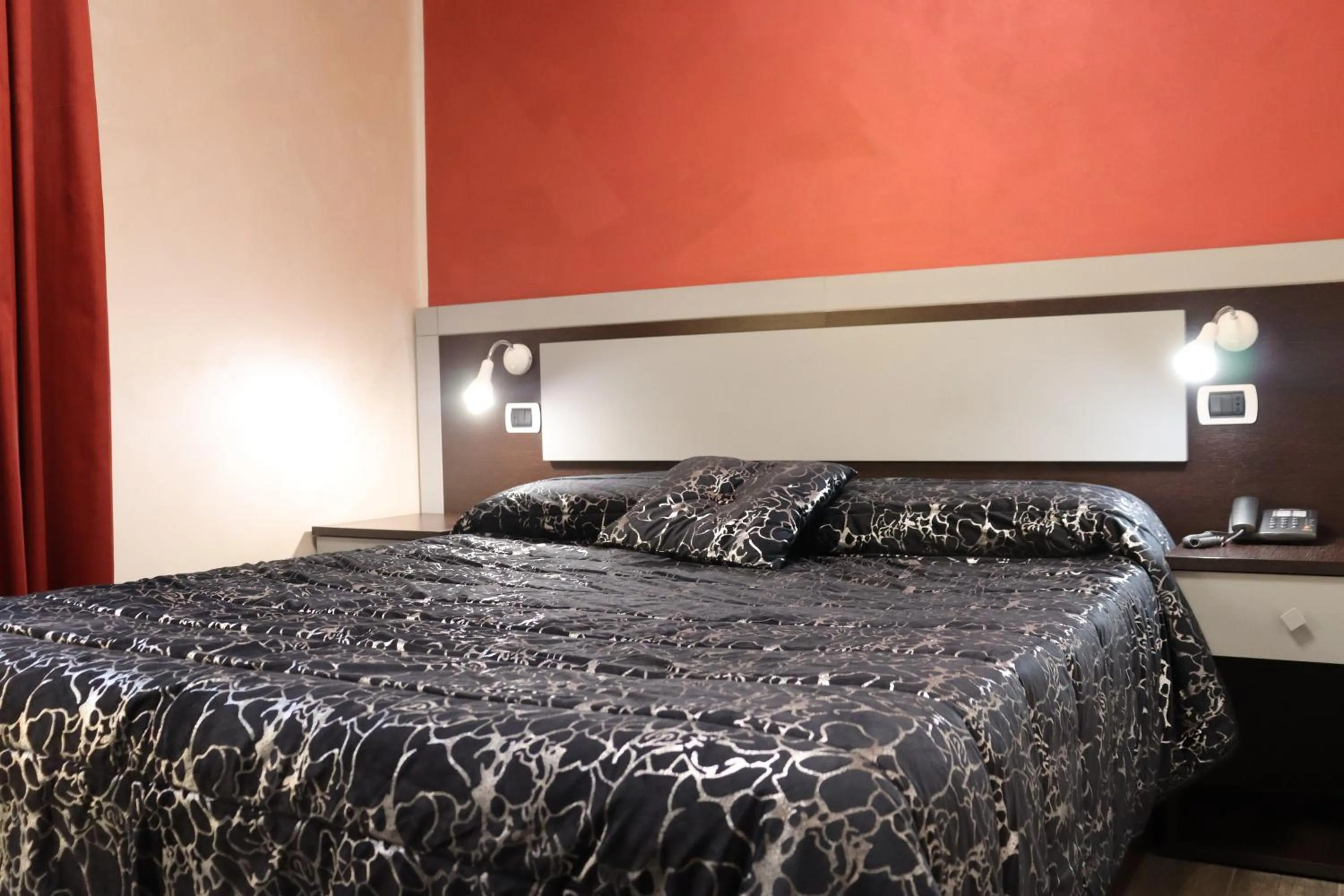 Bed in Hotel Paradiso