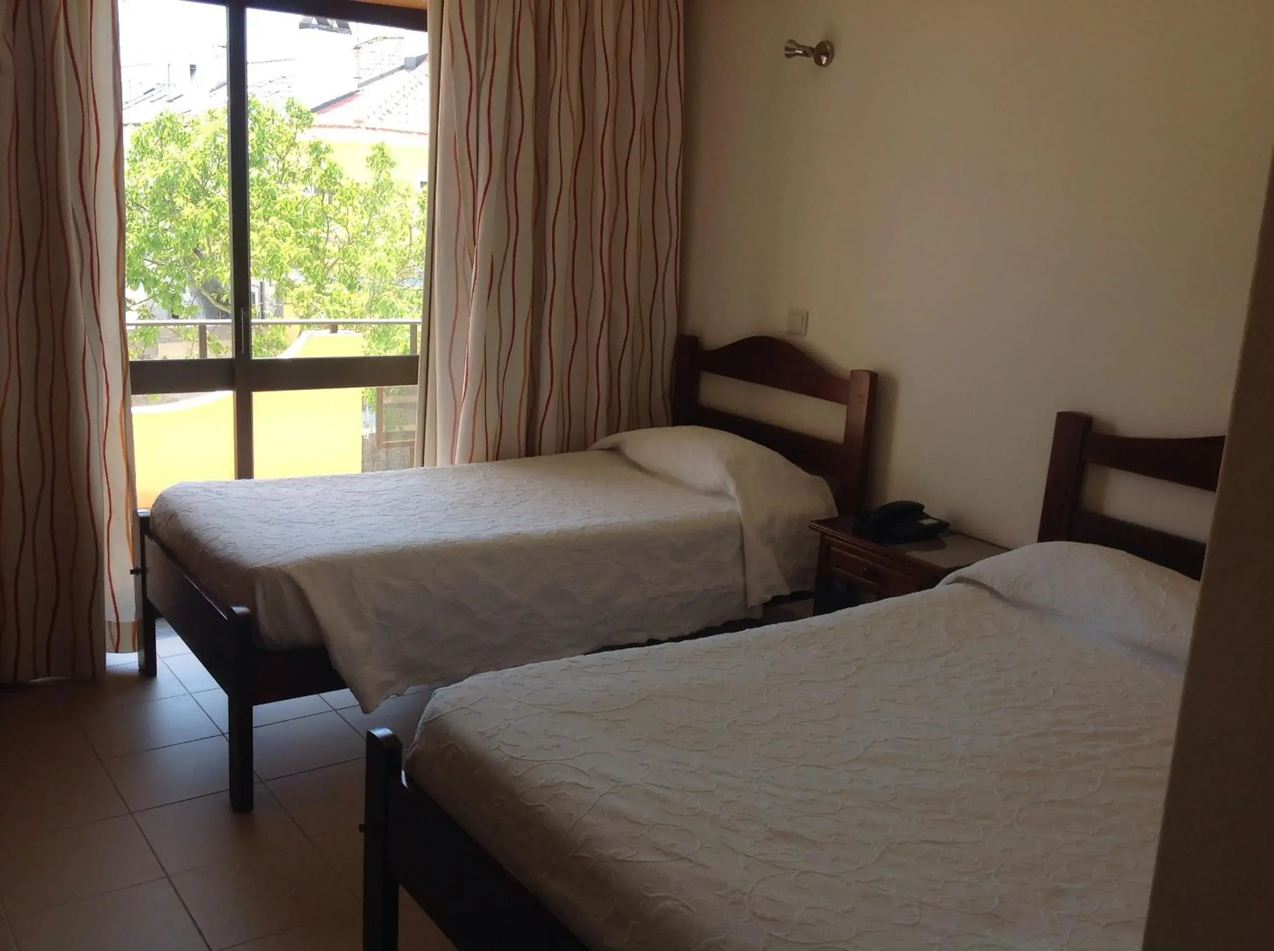 View (from property/room), Bed in Ribeiro Hotel View (from property/room), Bed in Ribeiro Hotel