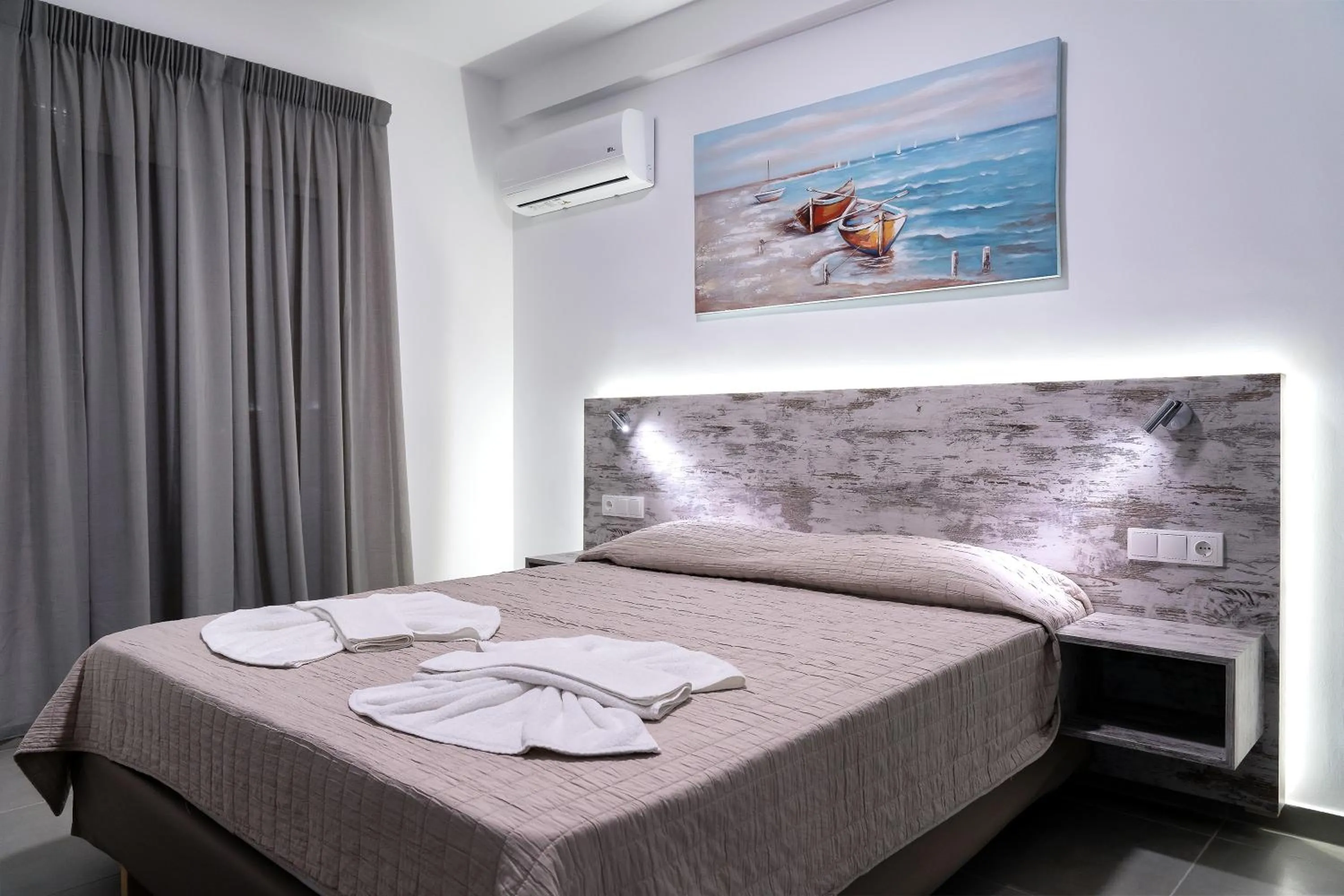 Bed in Aegean Horizon apartments