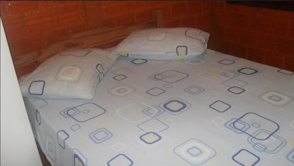 Bed in Ronaldo's Pousada