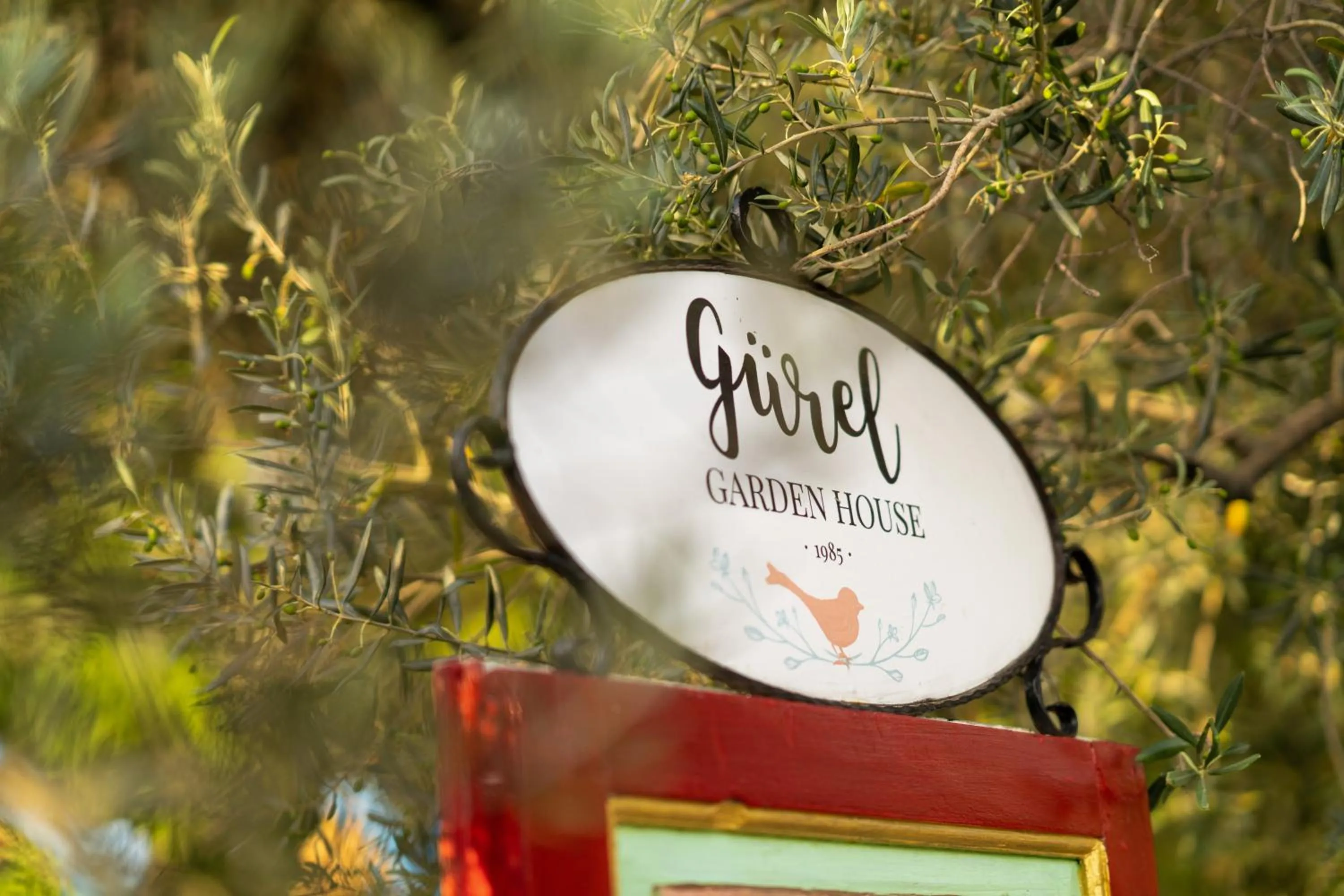 Property logo or sign in Gurel Garden House