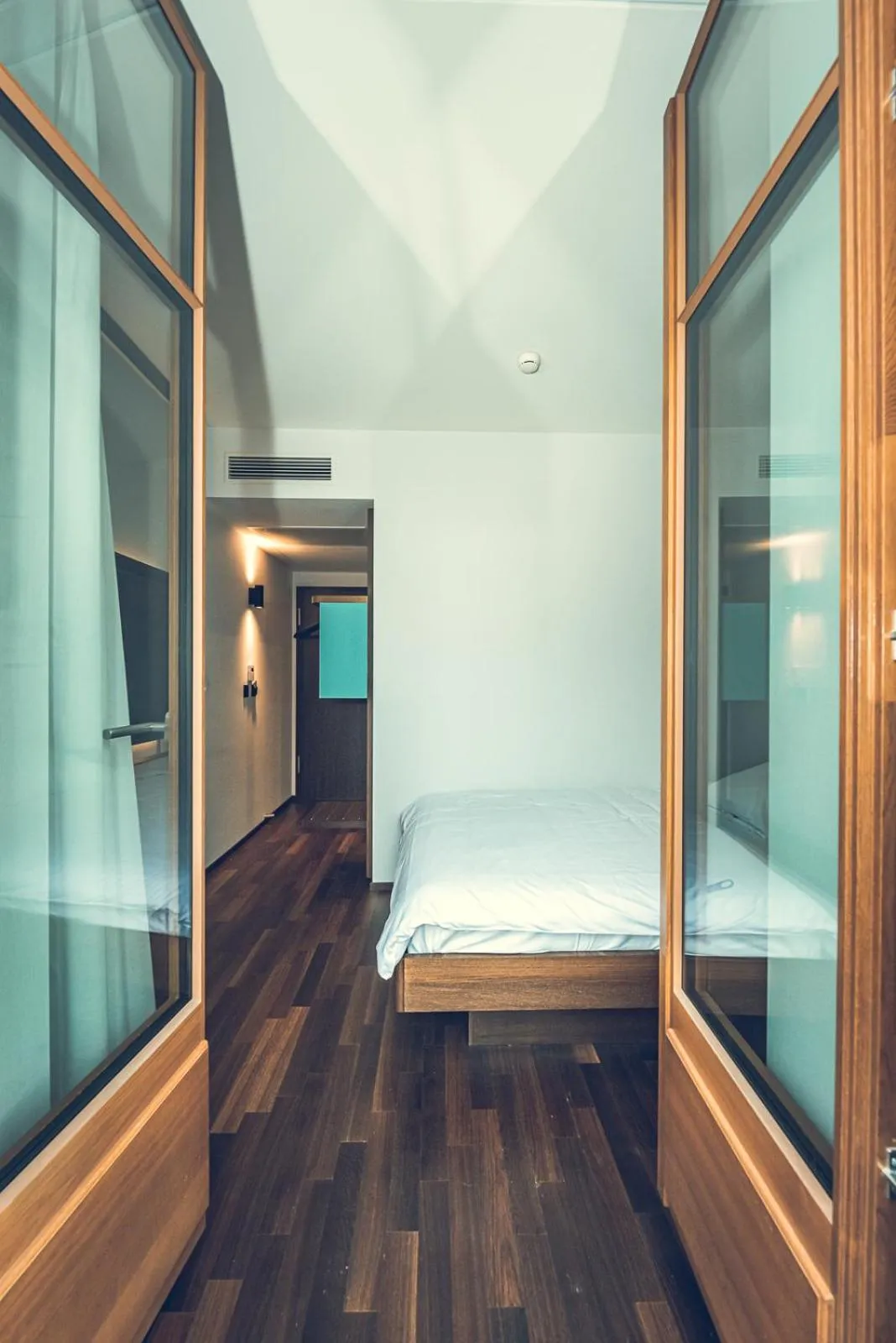 Bed in Hotel Bernina Geneva